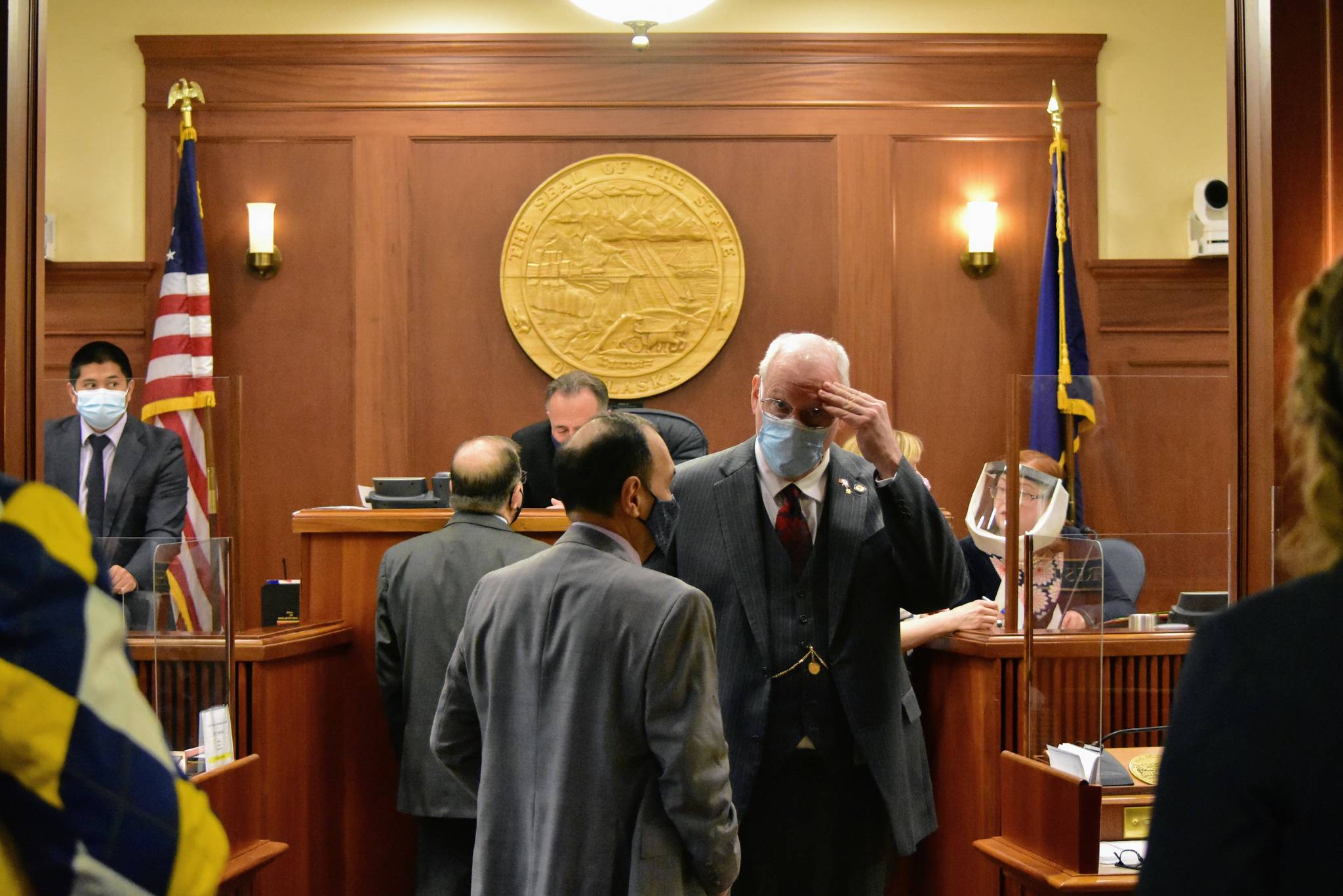 Sen. Bert Stedman, R-Sitka, speaks to Sen. Lyman Hoffman, D-Bethel, before a floor session to debate a bill over a disaster declaration in the state on Wednesday, April 28, 2021. The debate would take lawmakers into the evening Wednesday, as over 40 amendments were submitted on the bill. (Peter Segall / Juneau Empire)