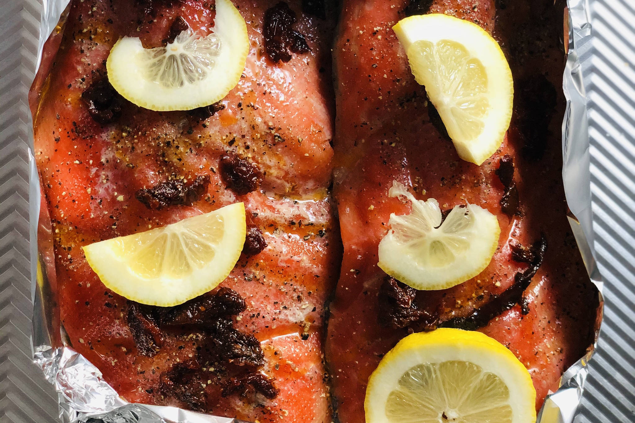 Salmon ready to go in the oven, photographed on Tuesday, March 16, 2021, in Anchorage, Alaska. (Photo by Victoria Petersen/Peninsula Clarion)