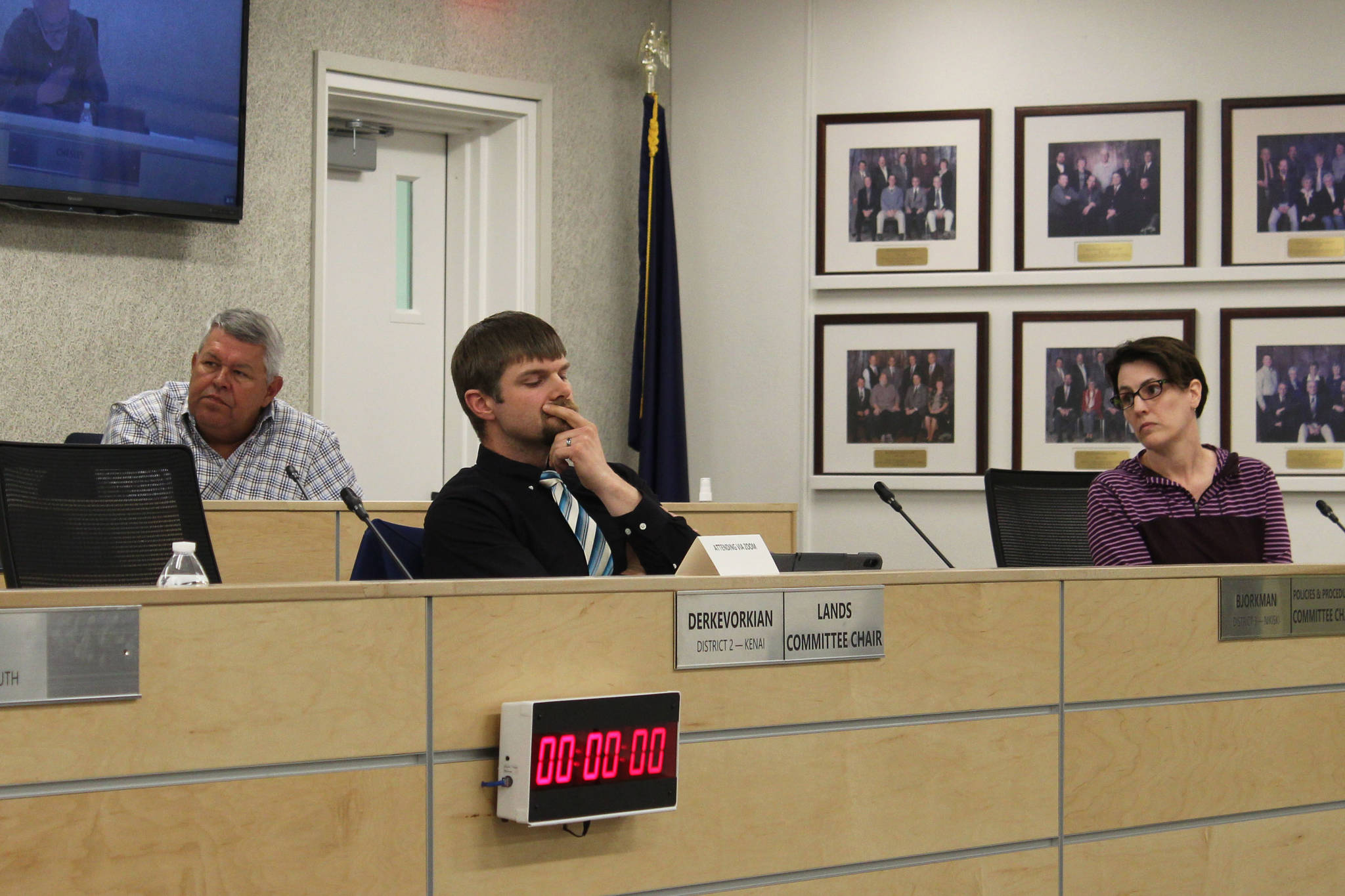 Charlie Pierce, Jesse Bjorkman and Brandi Harbaugh attend a meeting of the Kenai Peninsula Borough Assembly on Tuesday, May 4, 2021 in Soldotna, Alaska. (Ashlyn O’Hara/Peninsula Clarion)