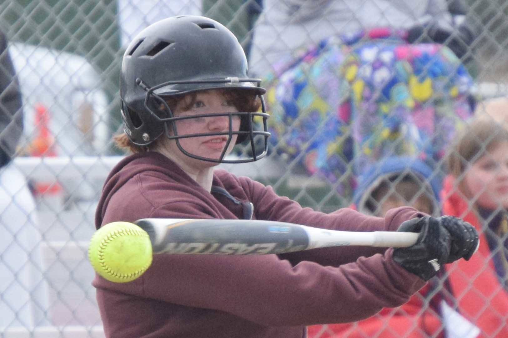 Kenai Central's Caitlin Crabb fouls off a pitch against Kodiak on Friday, May 7, 2021, in Kenai, Alaska. (Photo by Jeff Helminiak/Peninsula Clarion)