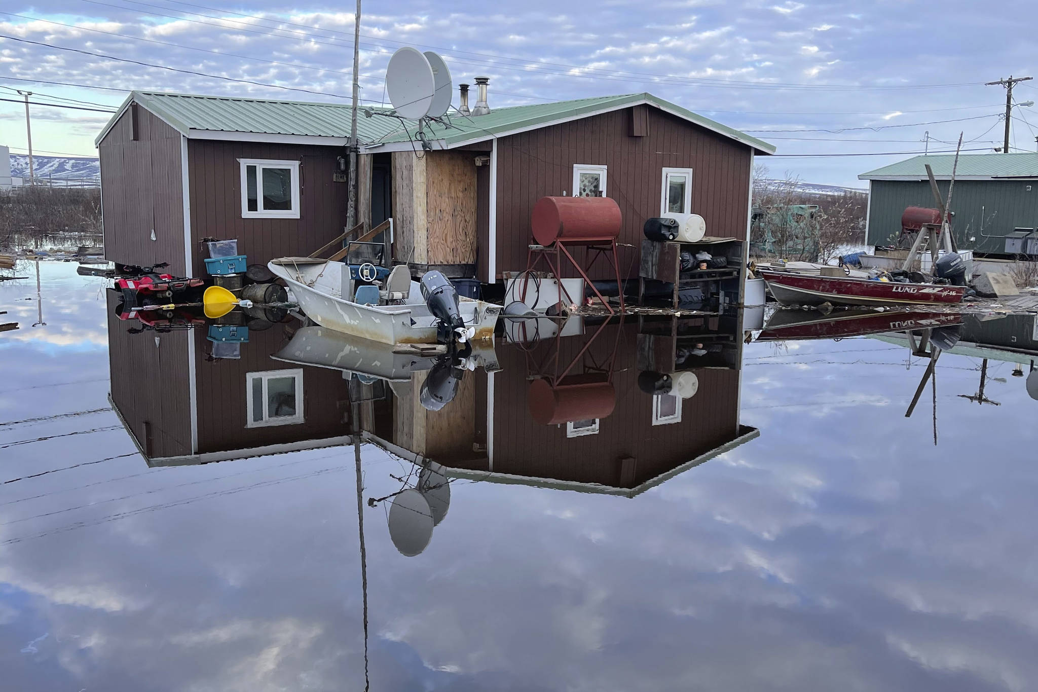 This photo provided by Nathan Hadley Jr. shows flooding in the village of Buckland, Alaska, on Thursday, May 13, 2021. An ice jam on the Buckland River, a half mile below the community, has caused the entire village of about 500 residents in northwest Alaska to be completely inundated. (Nathan Hadley Jr. via AP)