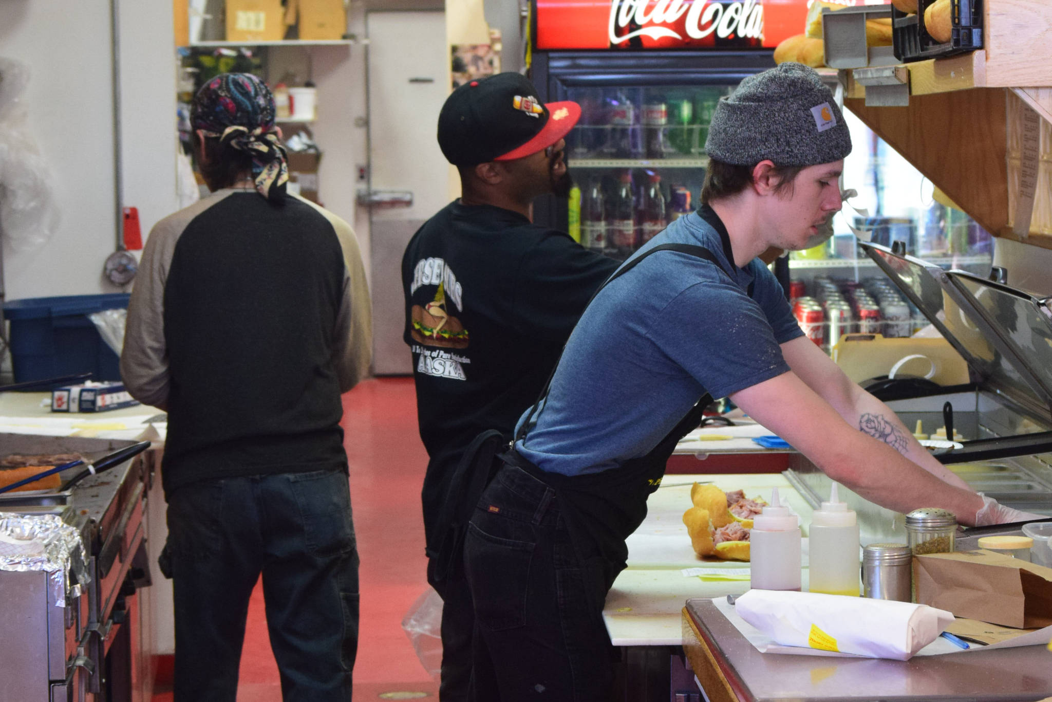 Employees work the lunch rush at Jersey Subs in Kenai, Alaska on Thursday, May 13, 2021. The sandwich shop is having trouble finding people to work this summer. (Camille Botello / Peninsula Clarion)