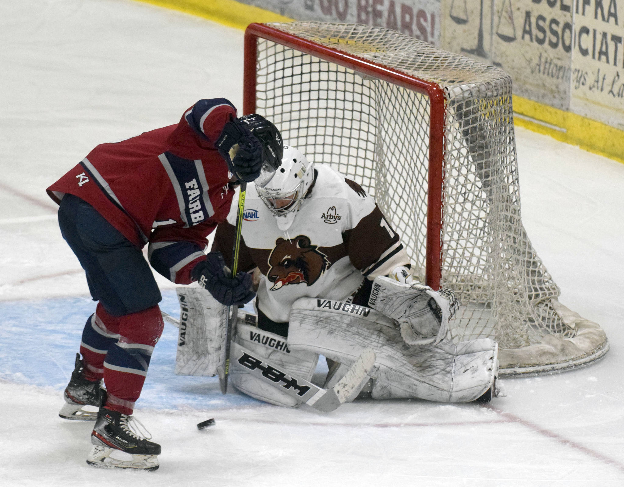 Laker Aldridge of the Fairbanks Ice Dogs tries to solve Kenai River Brown Bears goalie Luke Pavicich on Friday, May 14, 2021, at the Soldotna Regional Sports Complex in Soldotna, Alaska. (Photo by Jeff Helminiak/Peninsula Clarion)