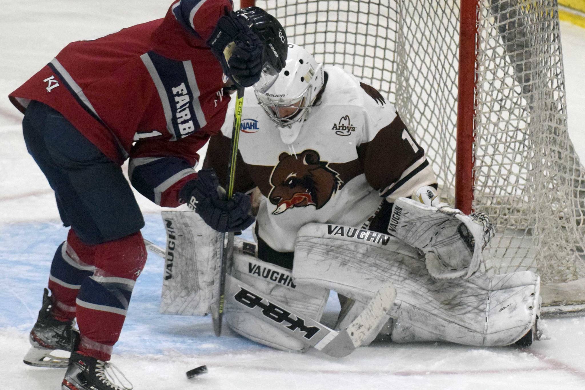 Laker Aldridge of the Fairbanks Ice Dogs tries to solve Kenai River Brown Bears goalie Luke Pavicich on Friday, May 14, 2021, at the Soldotna Regional Sports Complex in Soldotna, Alaska. (Photo by Jeff Helminiak/Peninsula Clarion)