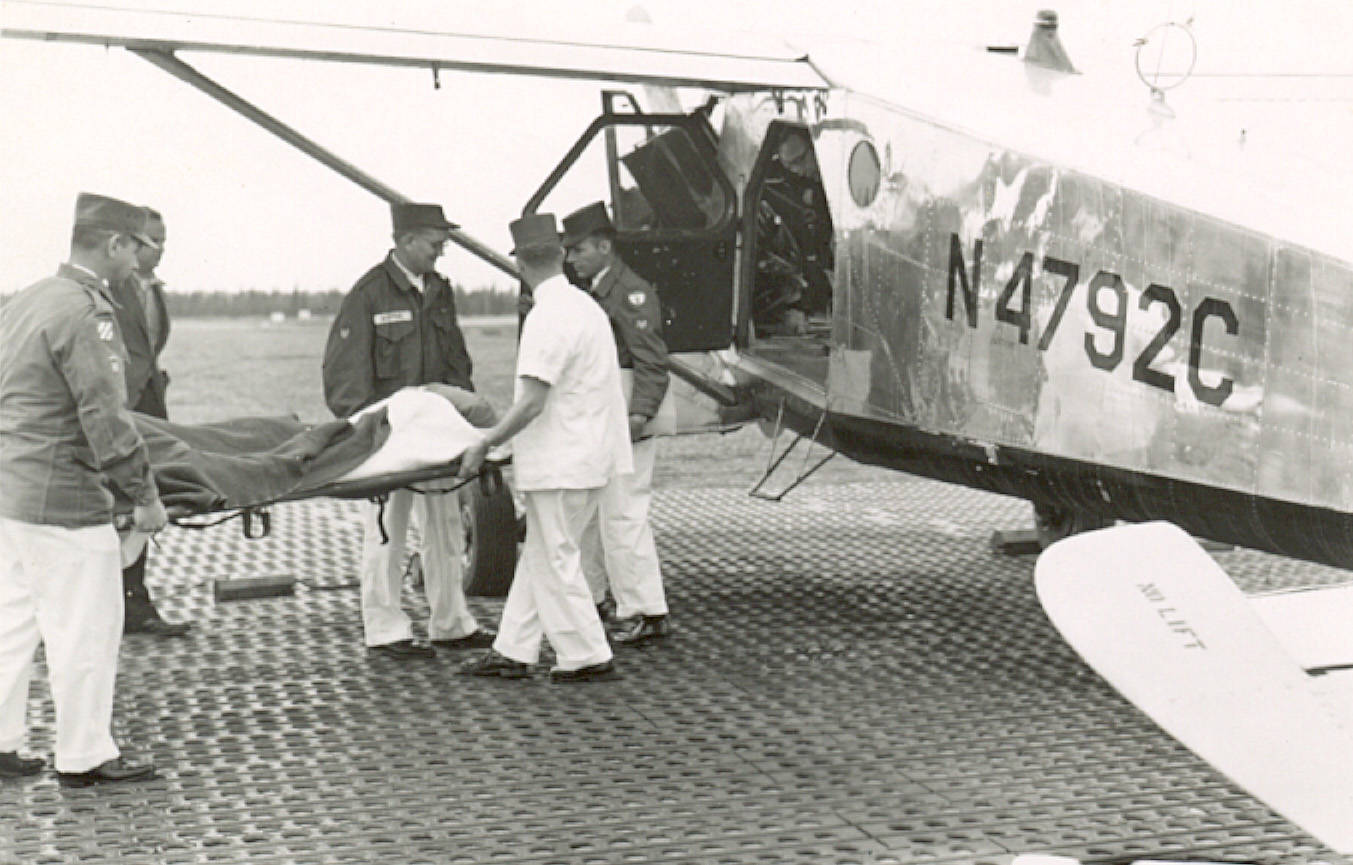 Before a hospital was established on the central Kenai Peninsula, air-evacuations to Anchorage were common. Here, at the Kenai airport in about 1960, soldier Francis Becker of Wildwood Army Station is loaded into the L-20 bound for the Elmendorf Air Force Base hospital. Becker had a badly cut and damaged leg from a construction accident. (Cheechako News file photo from KPC’s Kenai Peninsula Historical Photo Repository)