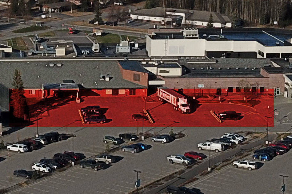 A parking lot set to be reconstructed is seen highlighted in red at Central Peninsula Hospital in Soldotna, Alaska. (Photo by Bruce Richards)