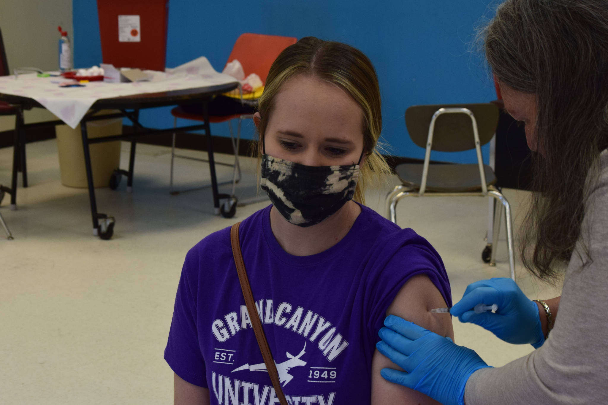 Soldotna resident Leah McCabe receives her first dose of the Pfizer-BioNTech COVID-19 vaccine at the The Soldotna Professional Pharmacy and Kenai Peninsula Borough Office of Emergency Management's walk-in clinic at Soldotna Prep School on Friday, May 14, 2021. (Camille Botello / Peninsula Clarion)