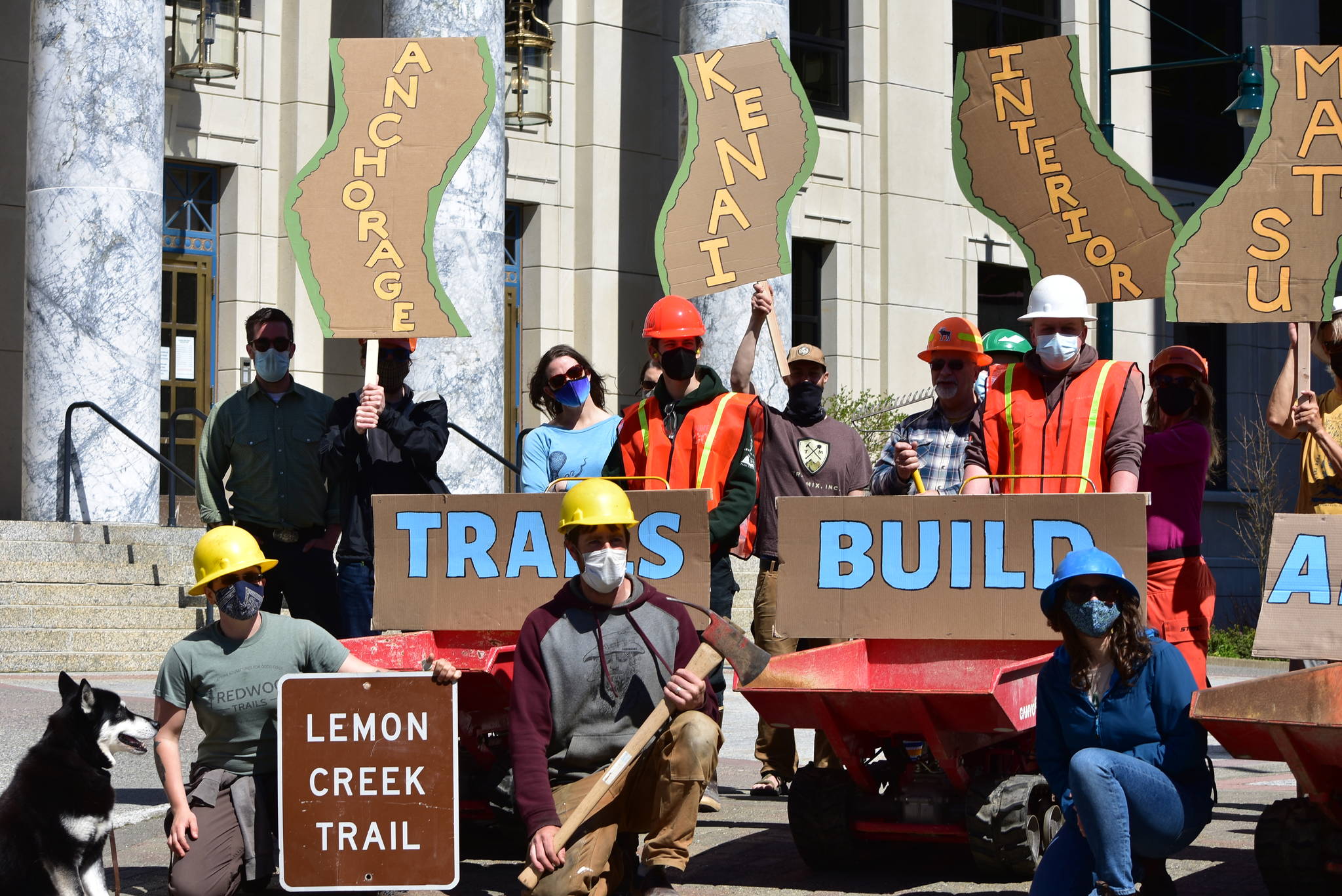 Supporters of the conservation corps programs established with CARES Act funding last year rallied in front of the Alaska State Capitol on Tuesday, May 18, 2021, to advocate for continued funding. (Peter Segall / Juneau Empire)