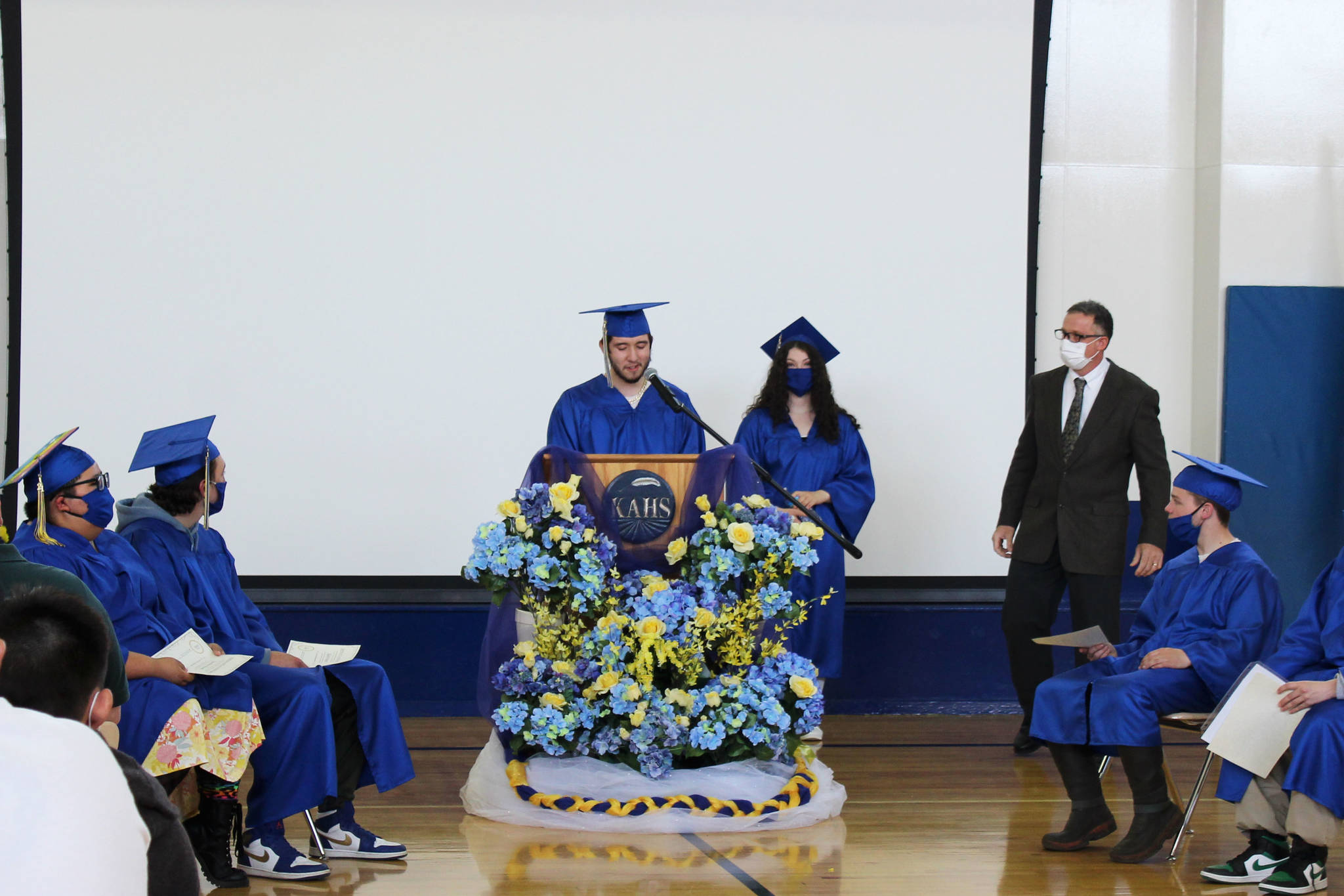 Jullian Miller (left) and Alivia Howard speak during Kenai Alternative High School’s 2021 graduation ceremony on Tuesday, May 18, 2021 in Kenai, Alaska. (Ashlyn O’Hara/Peninsula Clarion)