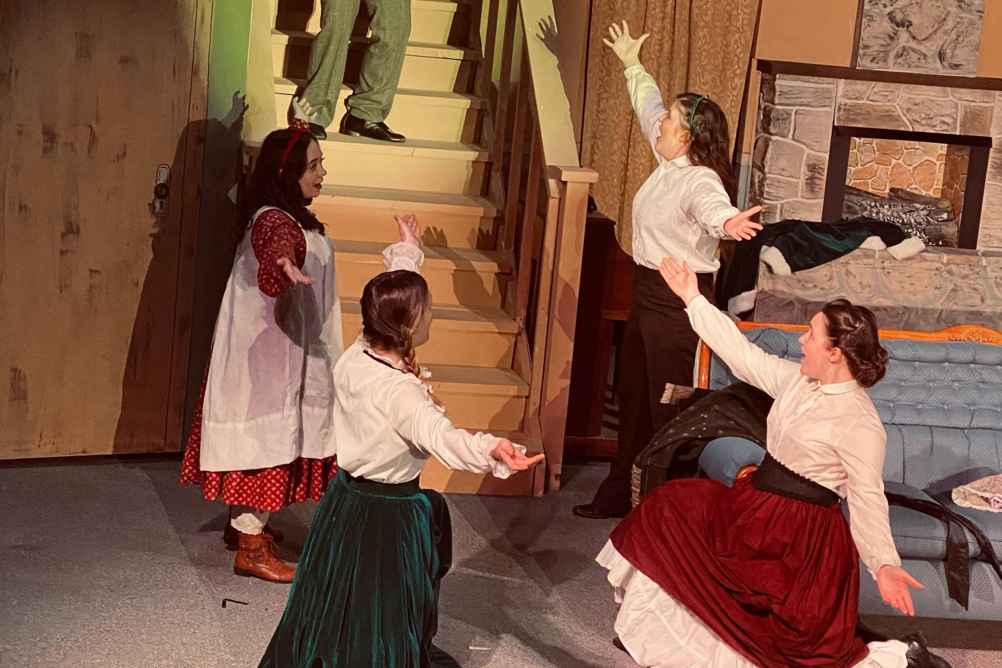 From left: Jayni Parish, Alyeska Krull, Selia Butler, Brittany Gilman and Braeden Garrett (center) act onstage as their characters the March sisters and Theodore “Laurie” Lawrence in the Kenai Performers’ production of “Little Women,” which headlines on Thursday, May 20, 2021. (Photo provided)
