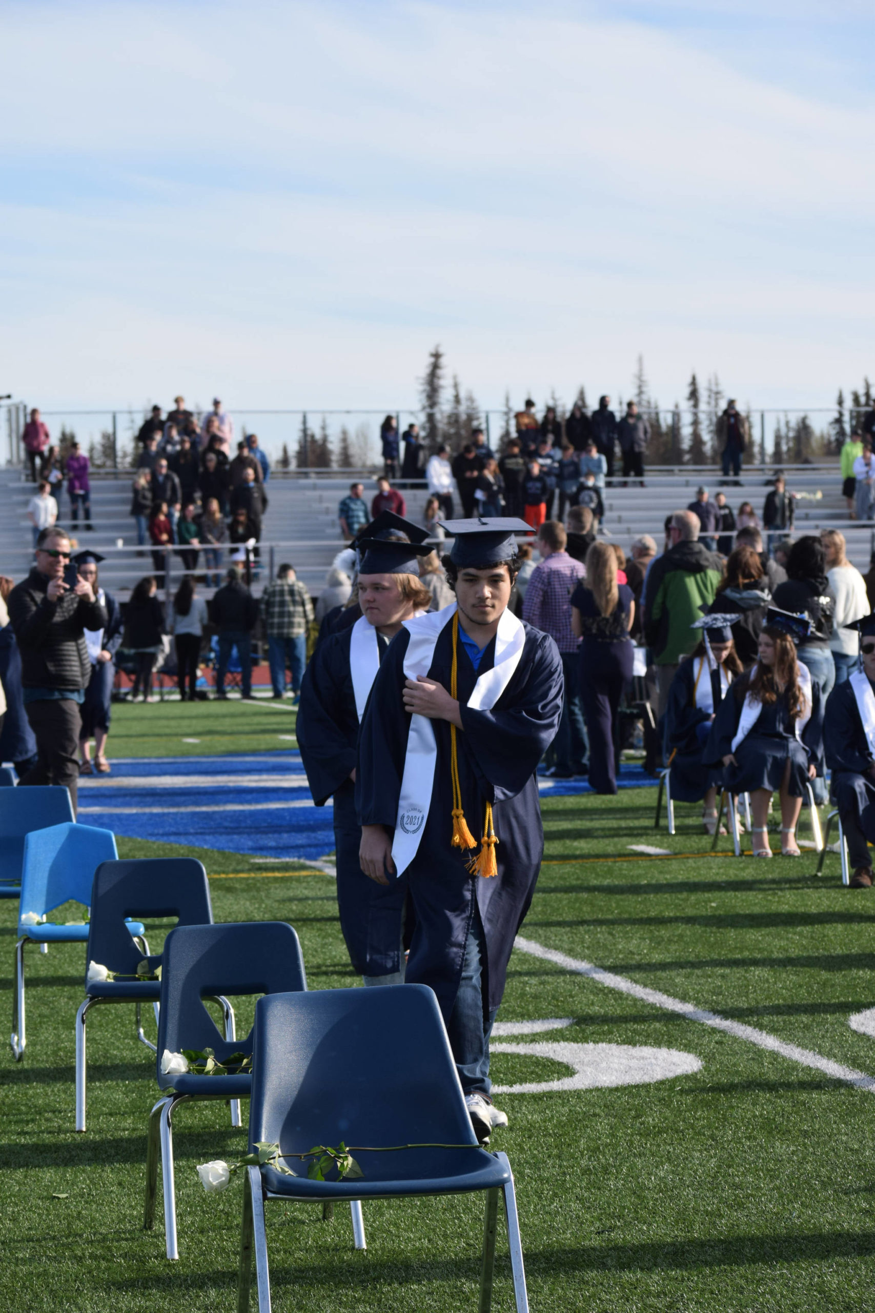 Soldotna High School students celebrate their graduation on Tuesday, May 18, 2021 at the high school football field. (Camille Botello / Peninsula Clarion)