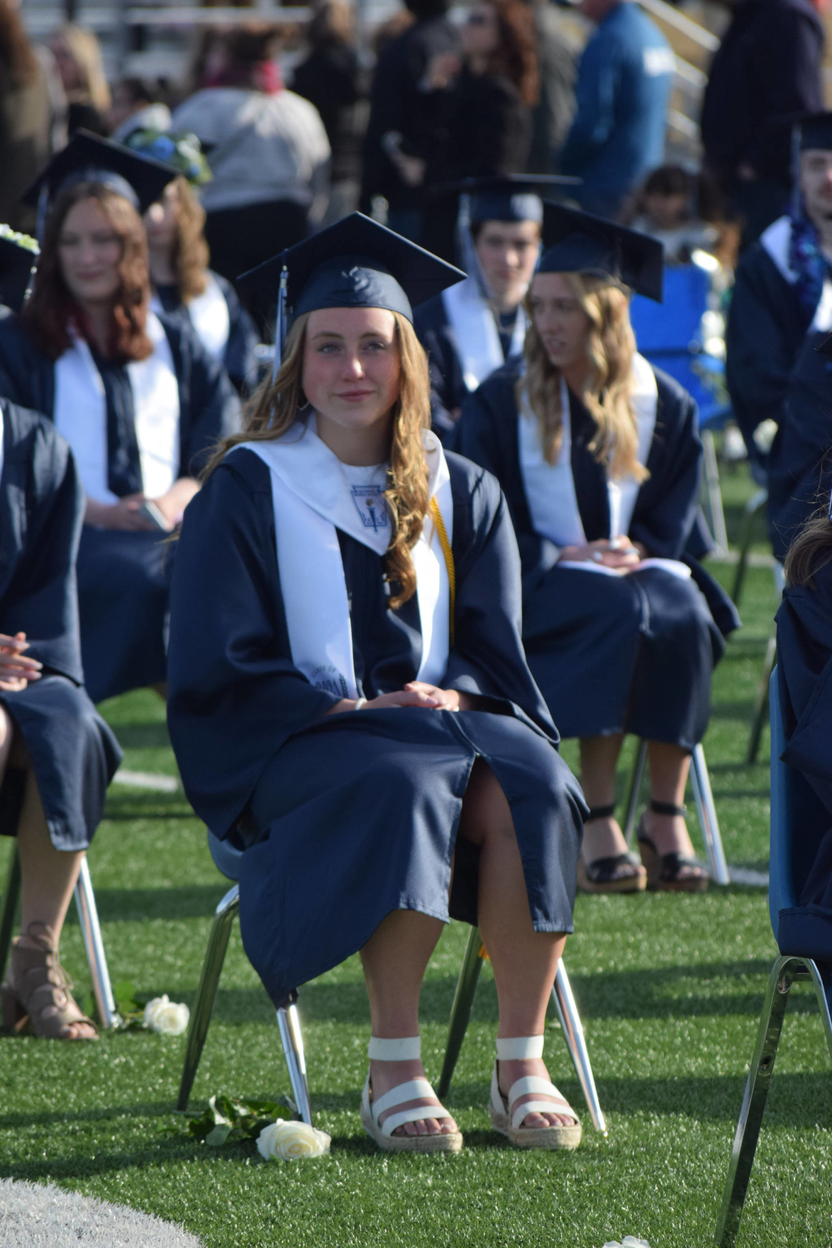 Soldotna High School class president and valedictorian Katie Delker celebrates her graduation on Tuesday, May 18, 2021 at the high school football field. (Camille Botello / Peninsula Clarion)