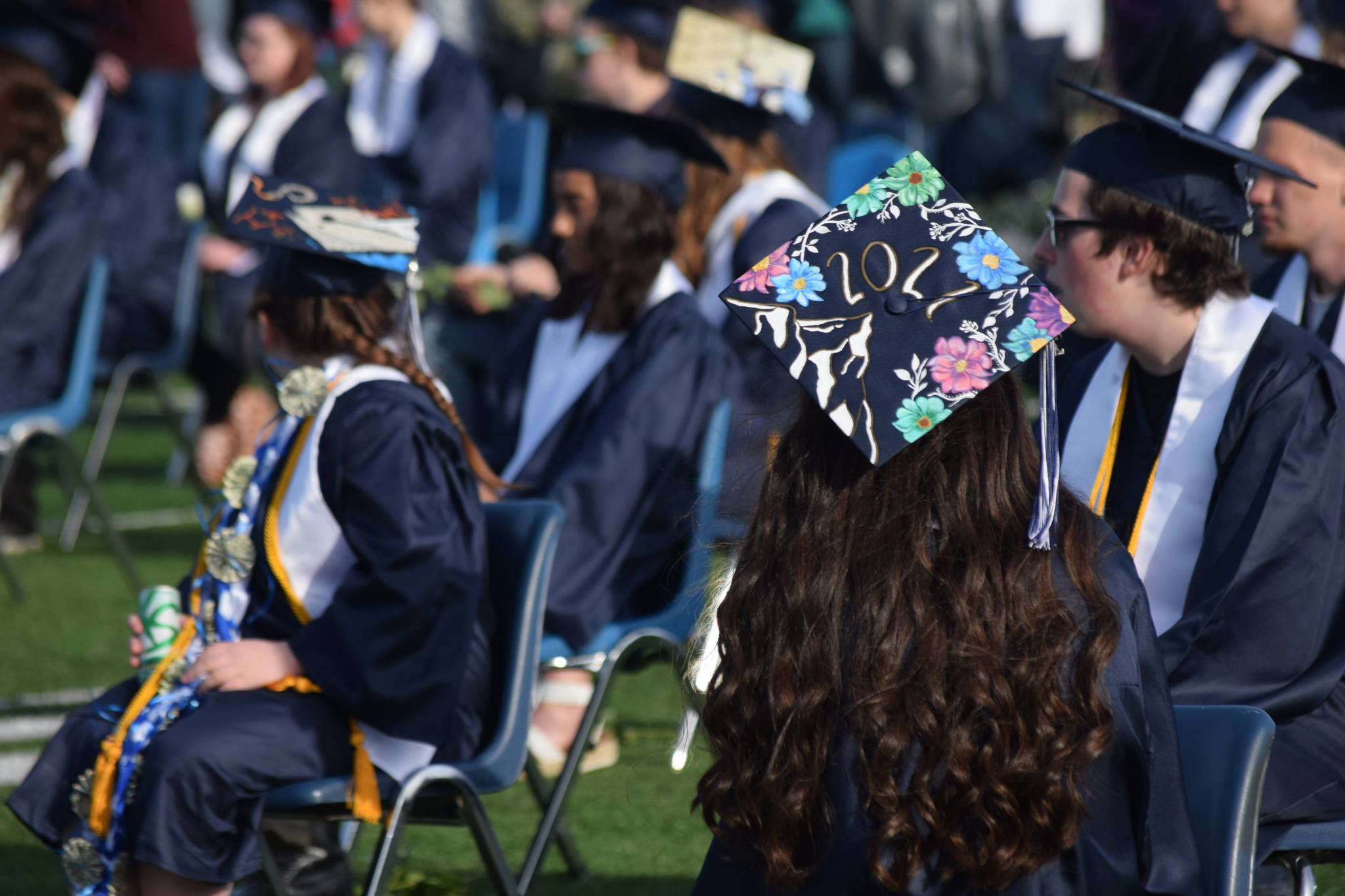 Soldotna High School students celebrate their graduation on Tuesday, May 18, 2021 at the high school football field. (Camille Botello / Peninsula Clarion)