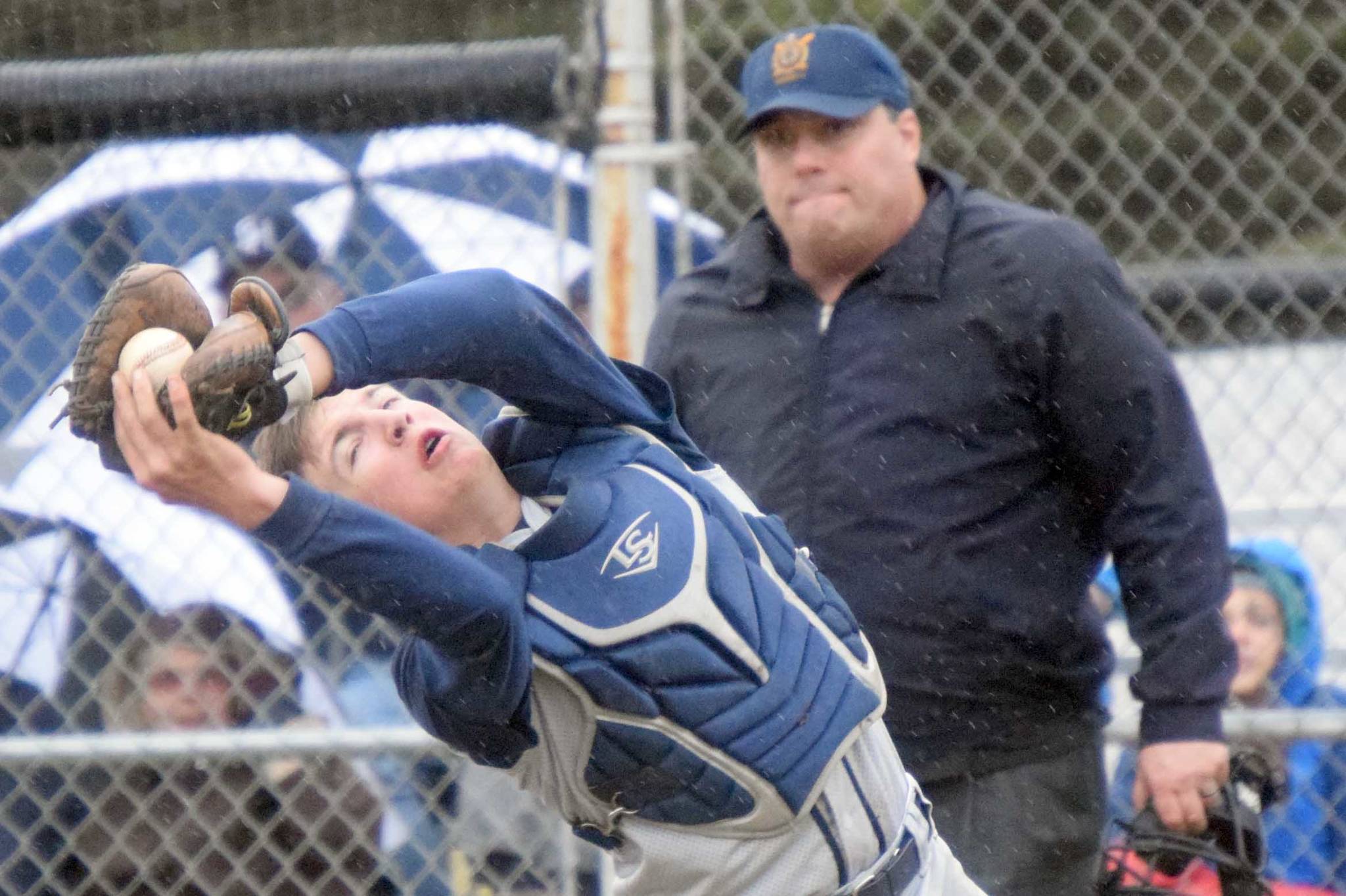 Soldotna catcher Gavin Jones records an out Wednesday, May 19, 2021, against Kenai Central at the Kenai Little League fields in Kenai, Alaska. (Photo by Jeff Helminiak/Peninsula Clarion)