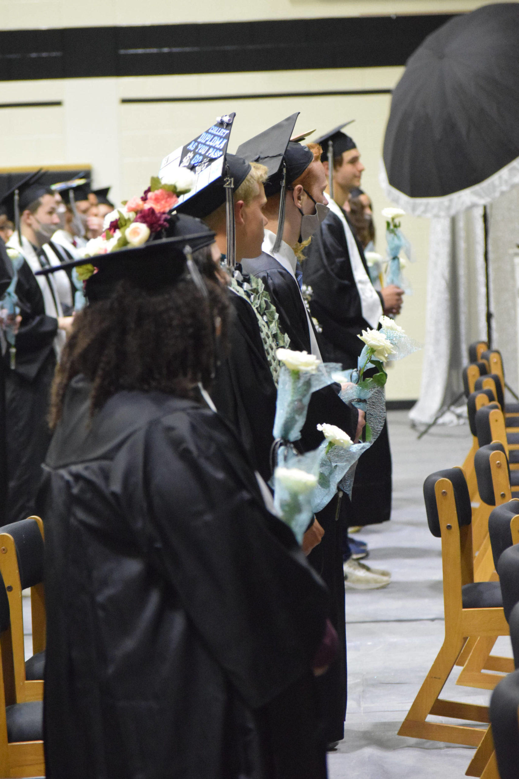 Seniors at Nikiski Middle/High School celebrate their graduation on Wednesday, May 19, 2021 in the gymnasium. (Camille Botello / Peninsula Clarion)