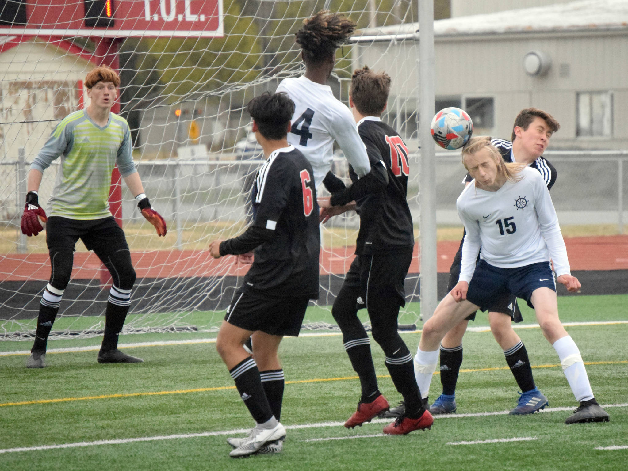 Homer’s Hunter Green flicks the ball on goal Friday, May 21, 2021, in the Peninsula Conference tournament at Kenai Central High School in Kenai, Alaska. (Photo by Jeff Helminiak/Peninsula Clarion)