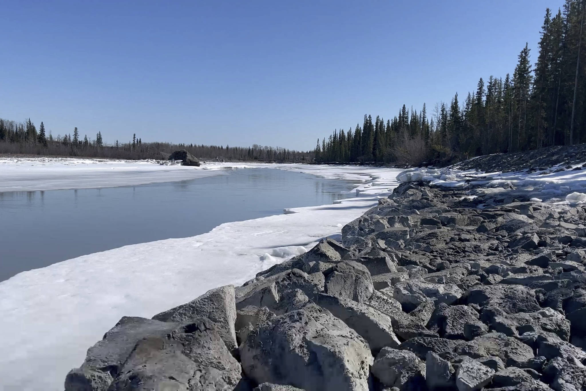 In this April 22, 2021, photo, signs of spring thaw appear along the Tazlina River in Tazlina, Alaska. The Catholic Church wants to sell 462 acres that once housed the Copper Valley mission school to the Native Village of Tazlina, a federally recognized tribe. The tribe is scrambling to raise the nearly $1.9 million asking price so it can regain stewardship of its ancestral land. (John Tierney/Indian Country Today)