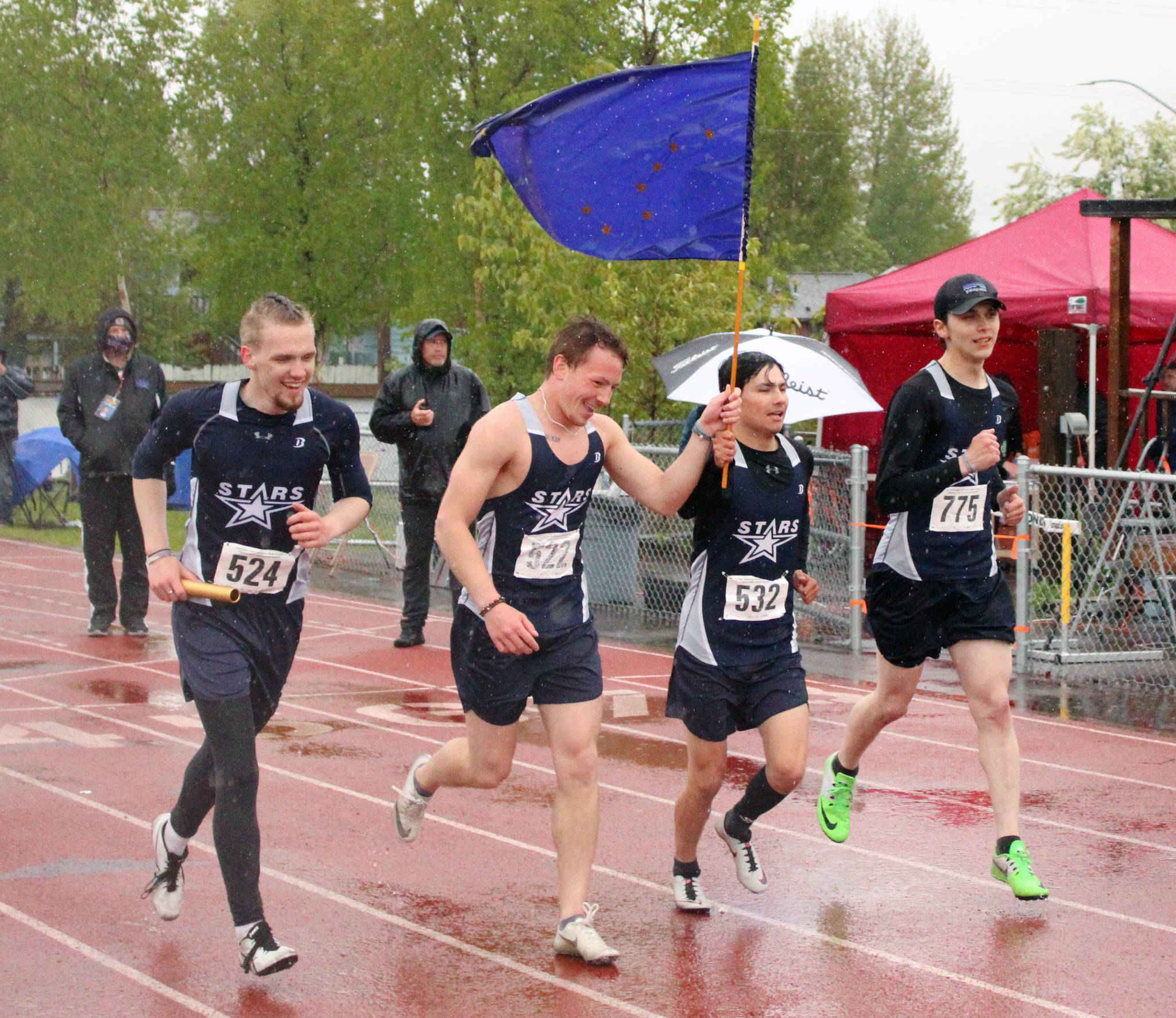Soldotna’s Eli Cravens, Zach Burns, Trenton O’Reagan and Avery Reid celebrate winning the 400-meter relay at the Division I state track and field meet at Dimond High School in Anchorage, Alaska, on Saturday, May 29, 2021. (Photo by Tim Rockey/Frontiersman)