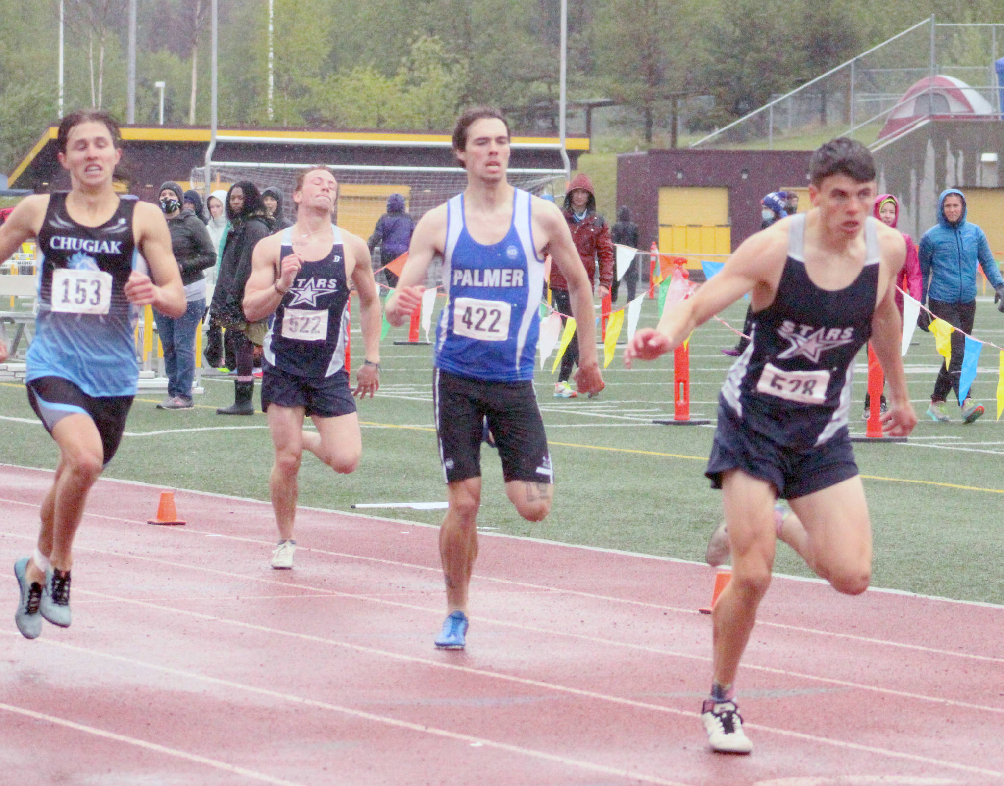 Soldotna’s Nathanael Johnson leans to win the 400 meters at the Division I state track and field meet at Dimond High School in Anchorage, Alaska, on Saturday, May 29, 2021. (Photo by Tim Rockey/Frontiersman)