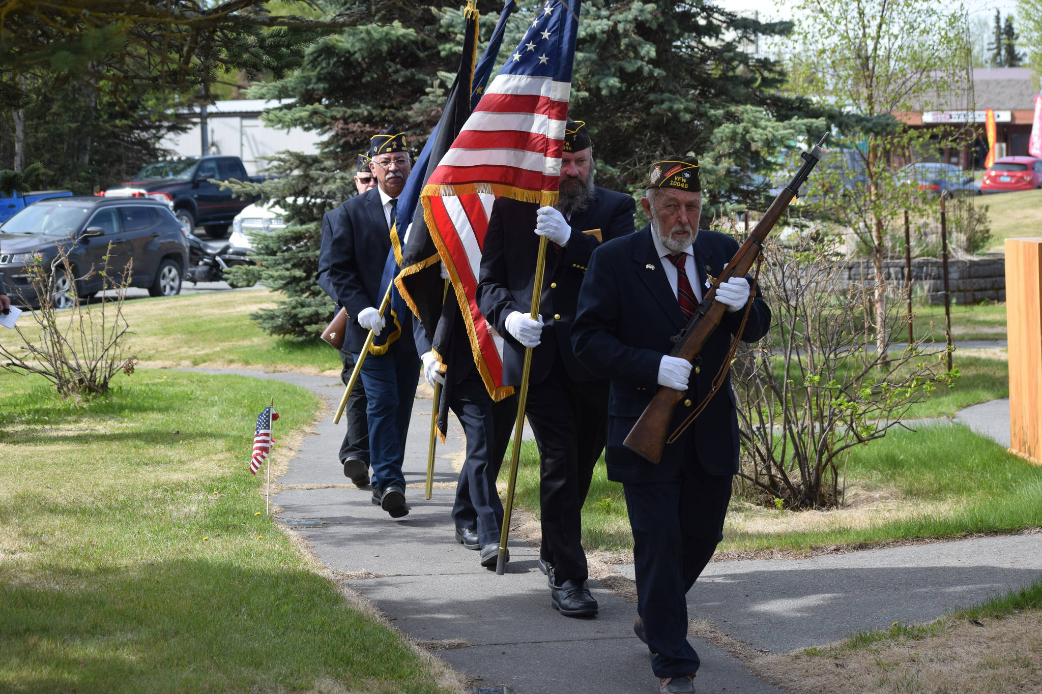 Honor Guard members proceed into the Memorial Day ceremony at Leif Hansen Memorial Park in Kenai, Alaska, on Monday, May 31, 2021. (Camille Botello/Peninsula Clarion)