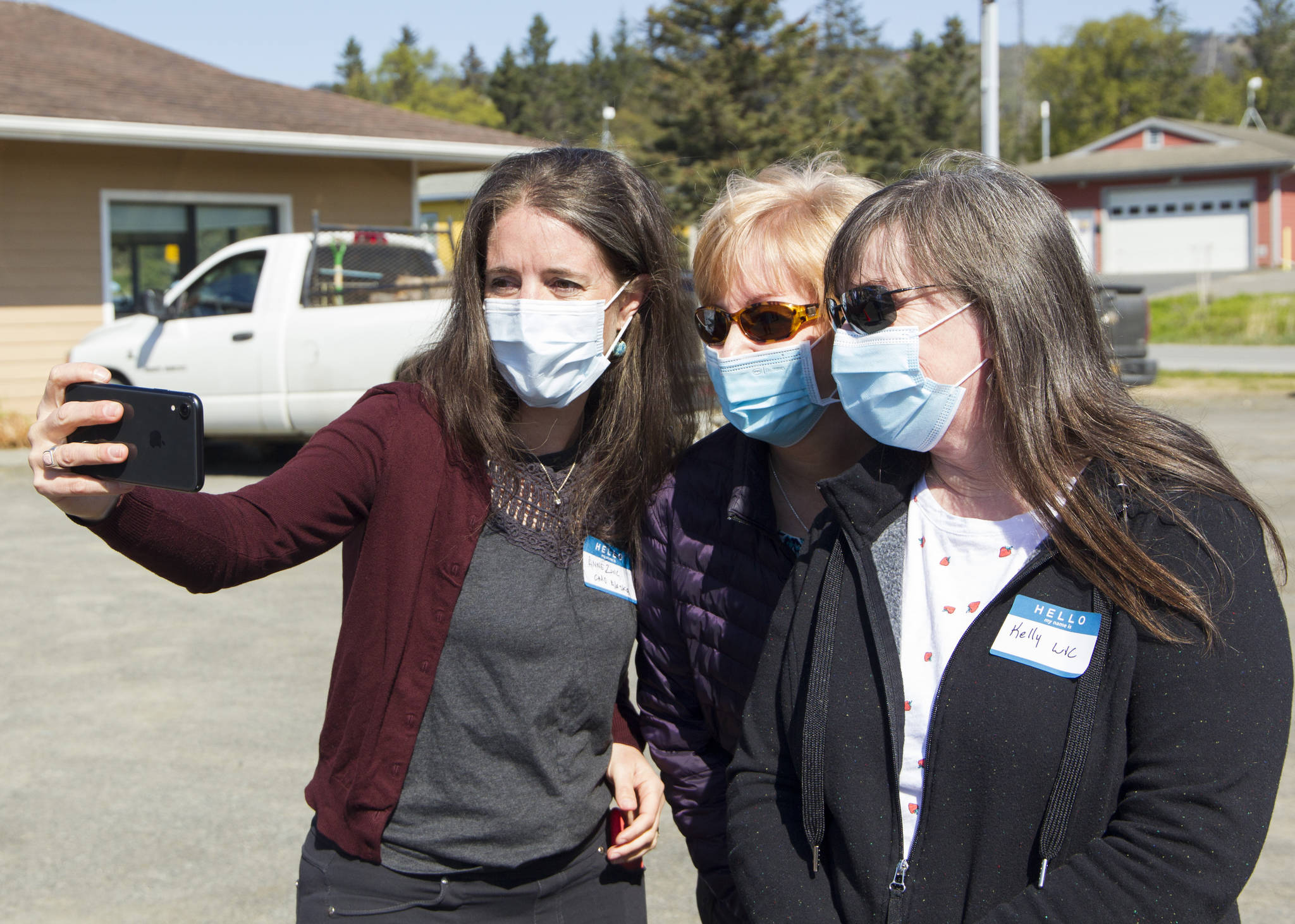 Alaska Chief Medical Officer Anne Zink, M.D., left, poses for a selfie with Kelly Bolt, right, and Debbie Gardner, center, who work at WIC, at a meet-and-greet on Thursday, May 27, 2021, at the Homer Public Health Center in Homer, Alaska. (Photo by Sarah Knapp/Homer News)