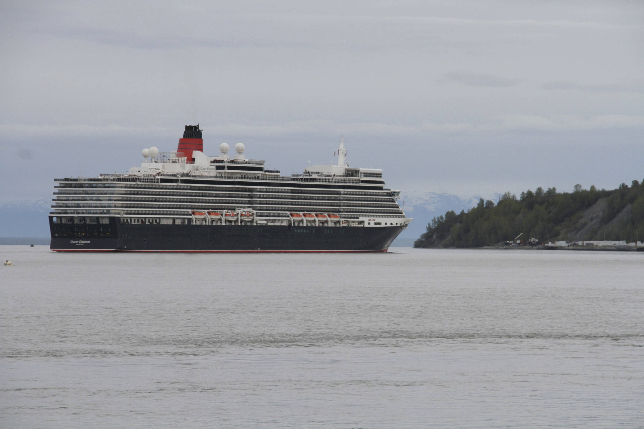 The Cunard cruise ship Queen Elizabeth sails through Cook Inlet Thursday, May 16, 2019, for a port call in Anchorage, Alaska. Federal officials say a lawsuit in Florida could block cruise ships from visiting Alaska in summer 2021. (AP Photo/Mark Thiessen, File)