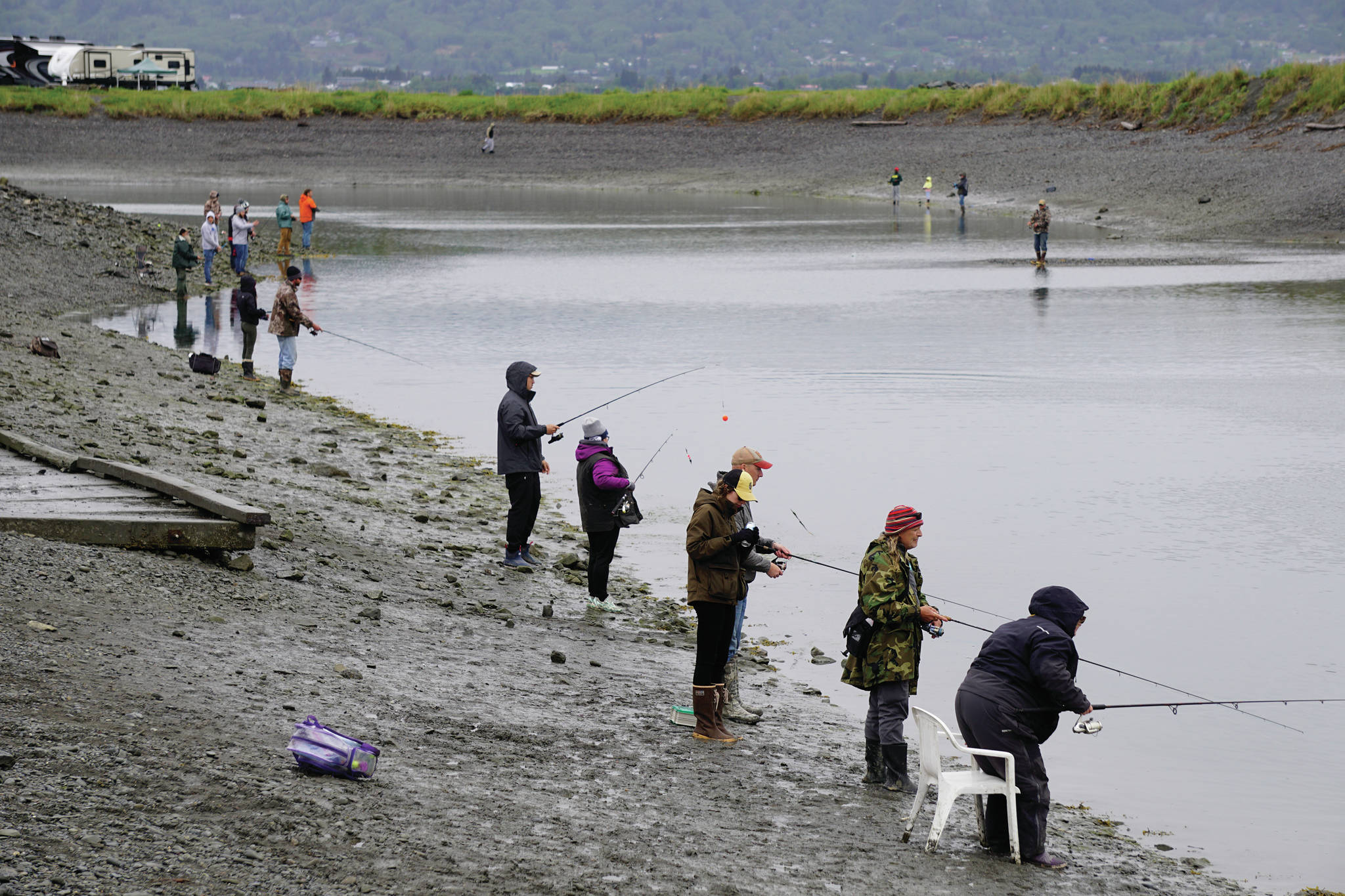 Anglers fish for king salmon on Saturday, May 29, 2021, at the Nick Dudiak Fishing Lagoon in Homer, Alaska. (Photo by Michael Armstrong/Homer News)