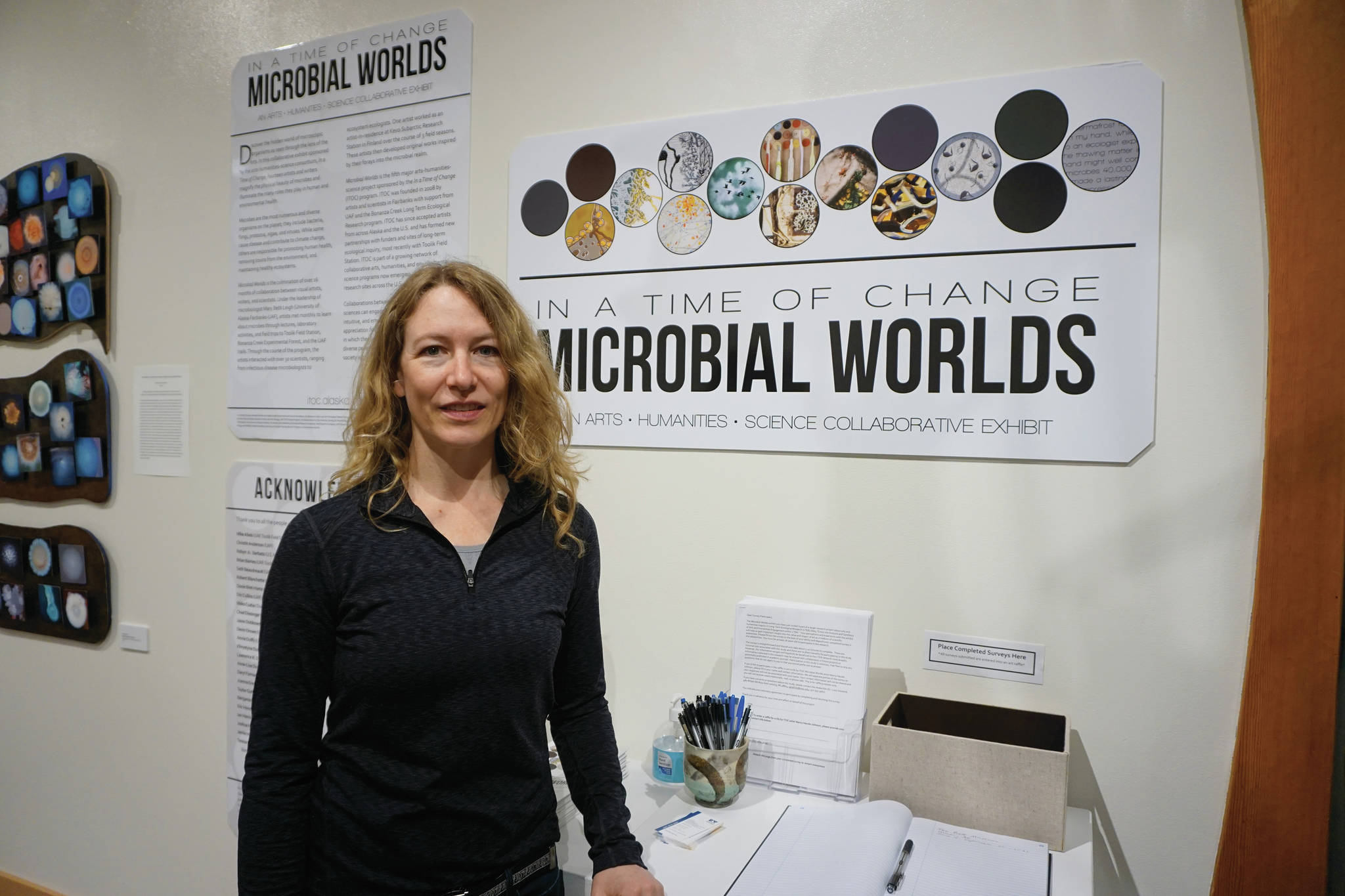 Photos by Michael Armstrong / Homer News
Mary Beth Leigh, director of the Microbial Worlds project, stands next to the exhibit on June 4 at the Pratt Museum & Park in Homer. The exhibit shows through the summer of 2021. Left, “Emergence,” by Nancy Hausle-Johnson.