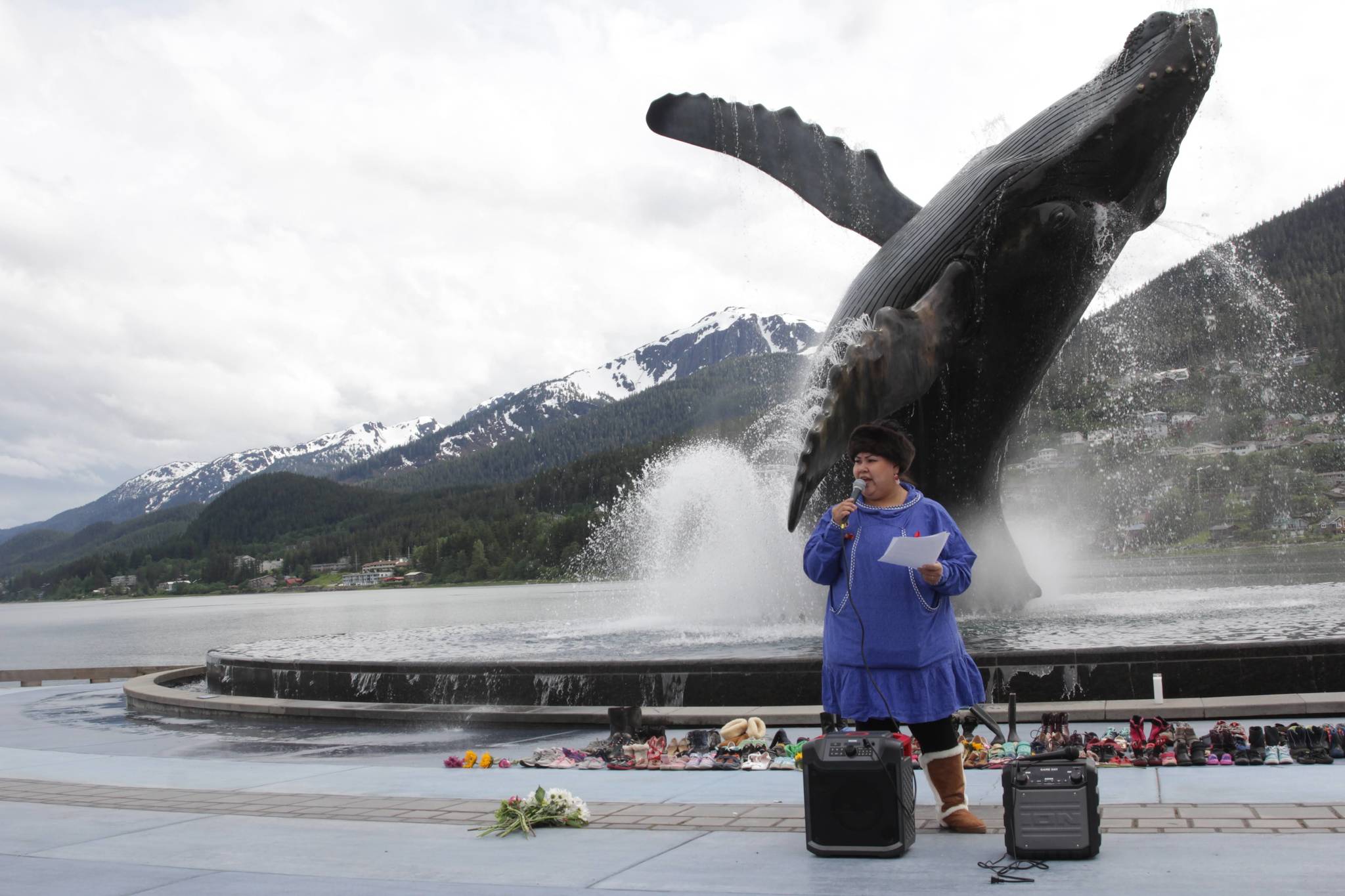 Jeni Brown speaks to a crowd during a vigil for the recently discovered victims of a Canadian residential school at Mayor Bill Overstreet Park on June 12, 2021 in Juneau, Alaska. (Michael S. Lockett/Juneau Empire)