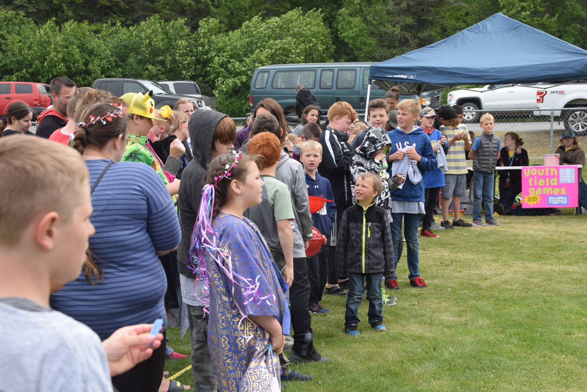 Kids wait to hear the winners of the bike raffle during the Family Fun in the Midnight Sun festival at the North Peninsula Recreation Center in Nikiski, Alaska, on June 15, 2019. (Peninsula Clarion file)