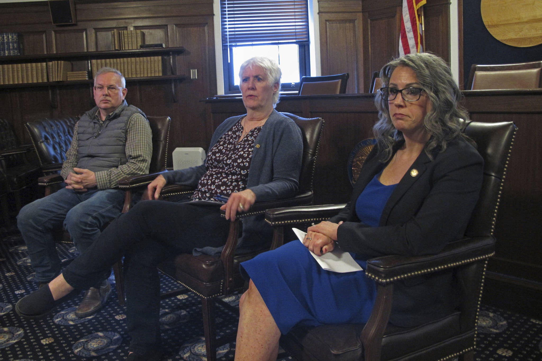 Alaska House Speaker Louise Stutes, center, along with leaders of the House majority coalition, Rep. Bryce Edgmon, left and Rep. Kelly Merrickspeaks, right, speak to reporters on the final day of a special legislative session in Juneau, Alaska Friday, June 18, 2021. The special legislative session limped toward a bitter end Friday, with Alaska Gov. Mike Dunleavy and House majority leaders sharply disagreeing over the adequacy of the budget passed by lawmakers earlier this week. (AP Photo/Becky Bohrer)