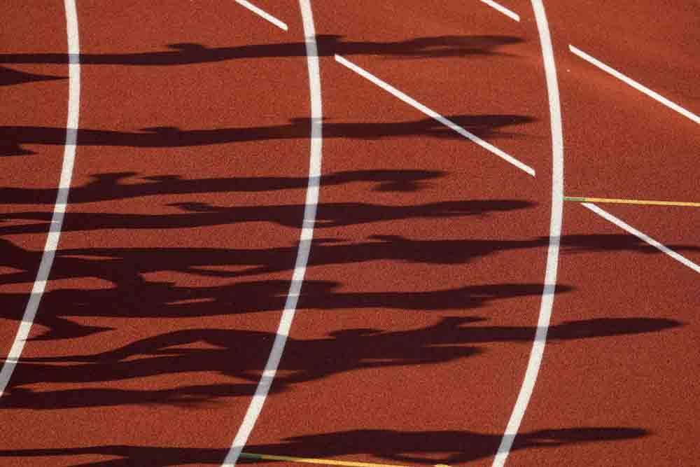 Runners in the first prelim of the women's 3000-meter steeplechase cast shadows at the U.S. Olympic Track and Field Trials on Sunday, June 20, 2021, in Eugene, Ore., at the U.S. Olympic Track and Field Trials. (AP Photo/Charlie Riedel)