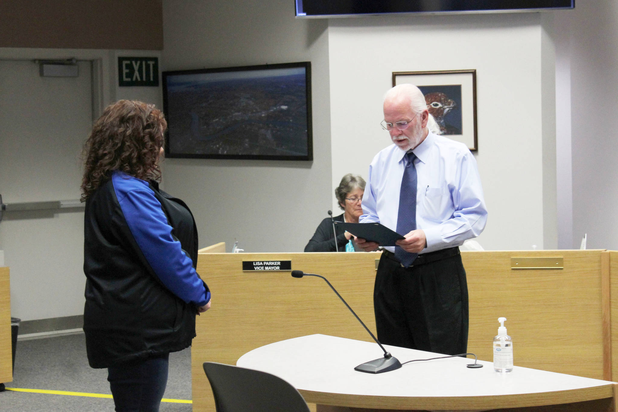 Soldotna Mayor Paul Whitney (right) presents Soldotna Chamber of Commerce Executive Director Shanon Davis with a proclamation on Wednesday, June 23, 2021 in Soldotna, Alaska. (Ashlyn O’Hara/Peninsula Clarion)