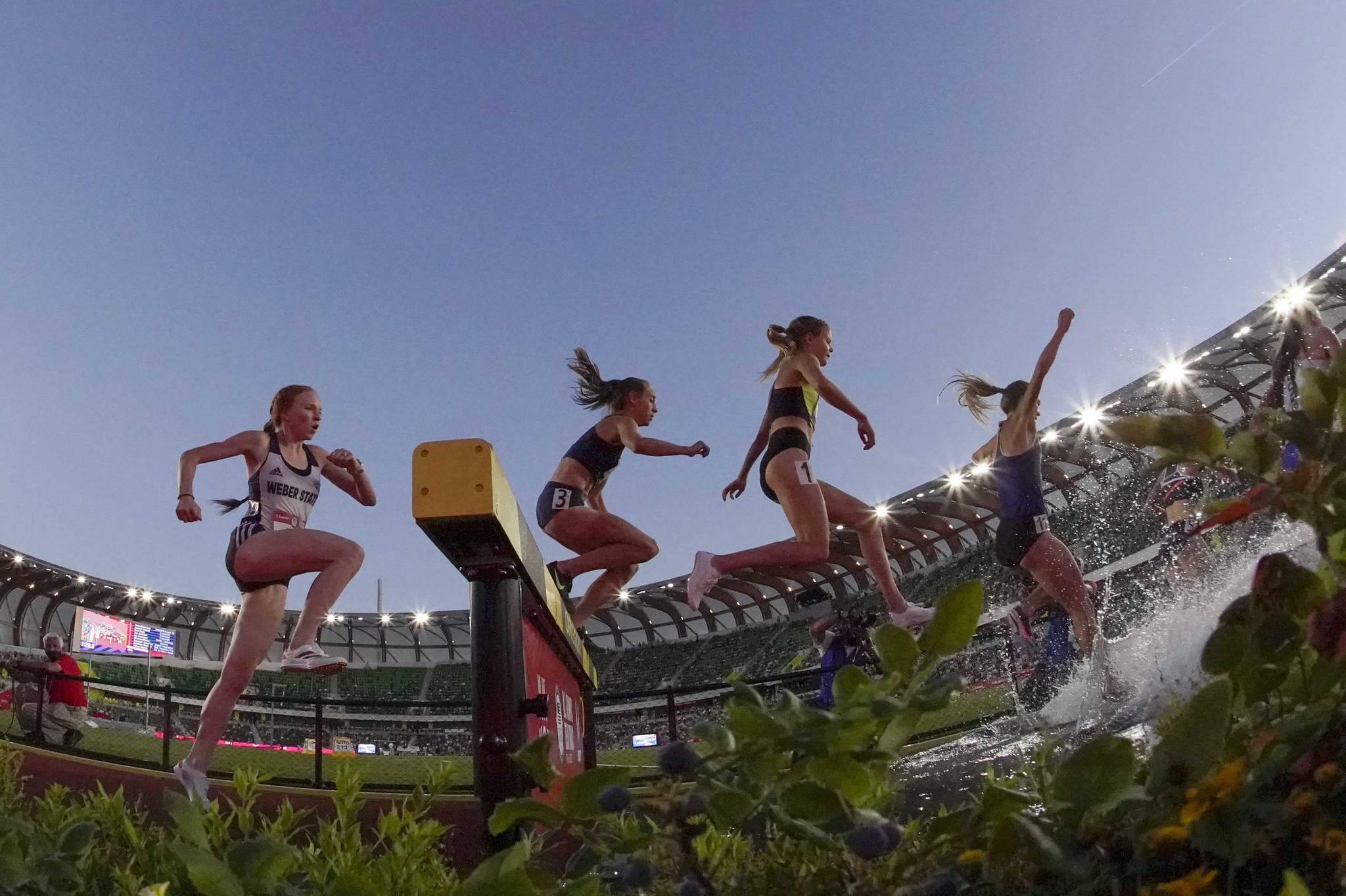 Allie Ostrander, third from left, competes in the women's 3000-meter steeplechase at the U.S. Olympic Track and Field Trials on Thursday, June 24, 2021, in Eugene, Oregon. (AP Photo/Charlie Riedel)