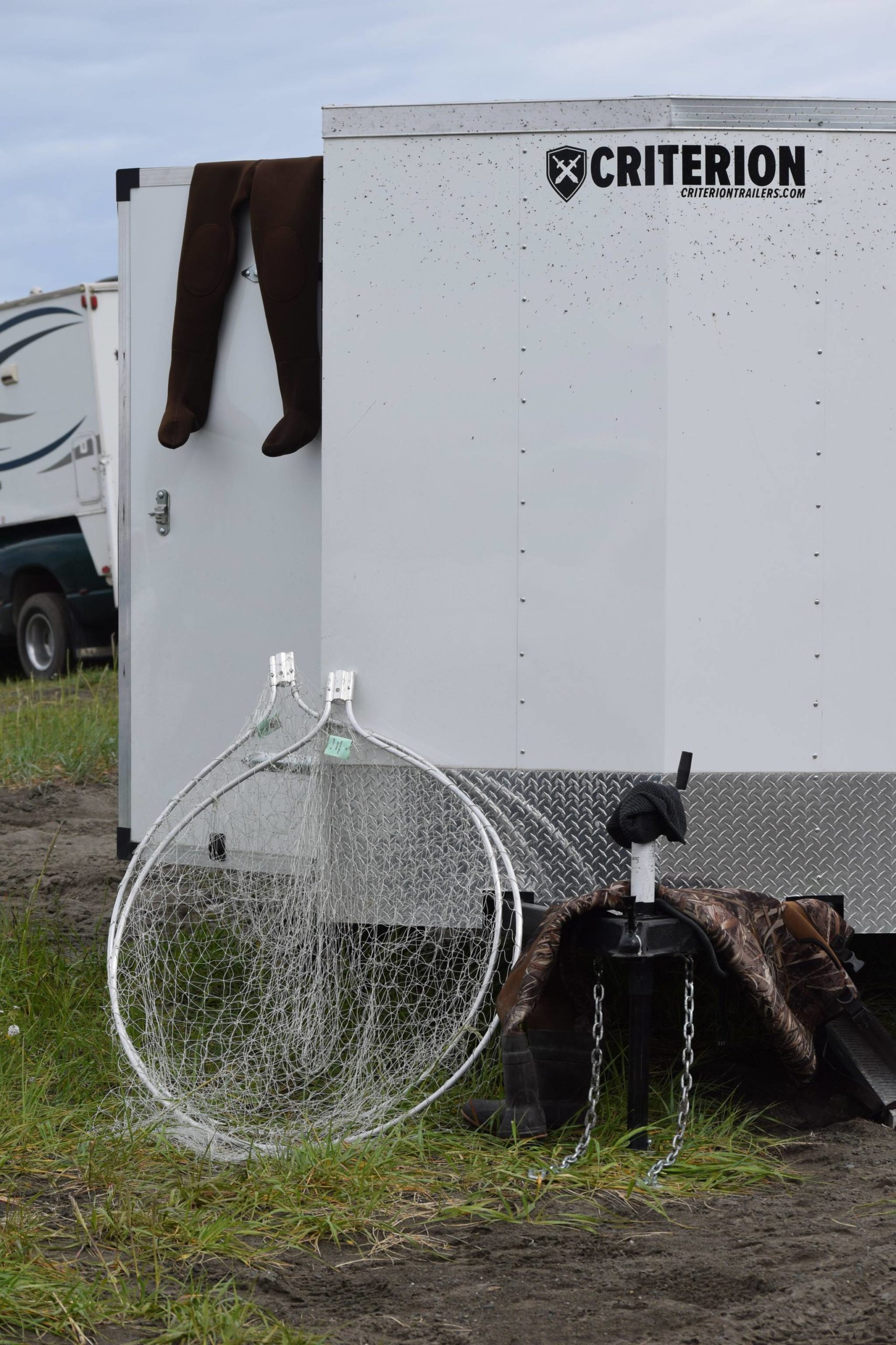 Dipnets lean against a trailer at Kasilof River State Recreational Site in Kasilof, Alaska, on Friday, June 25, 2021. The Kasilof River dipnet opening yields anglers from all over the state. (Camille Botello/Peninsula Clarion)