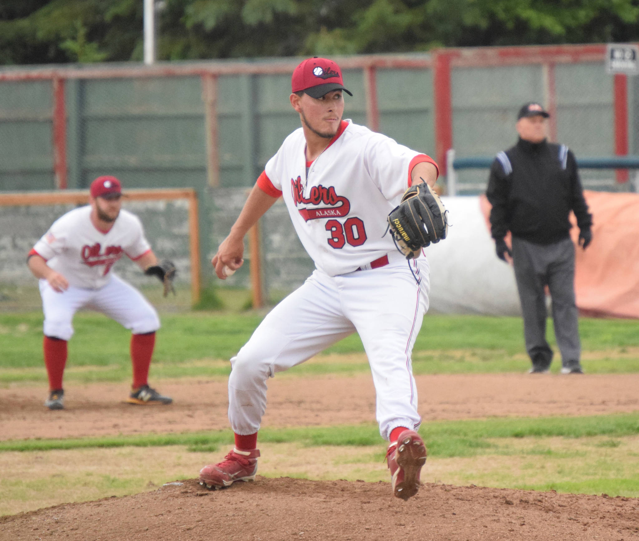 Oilers starting pitcher Lee Atkinson delivers to the Anchorage Bucs on Friday at Coral Seymour Memorial Park in Kenai. (Photo by Jeff Helminiak/Peninsula Clarion)