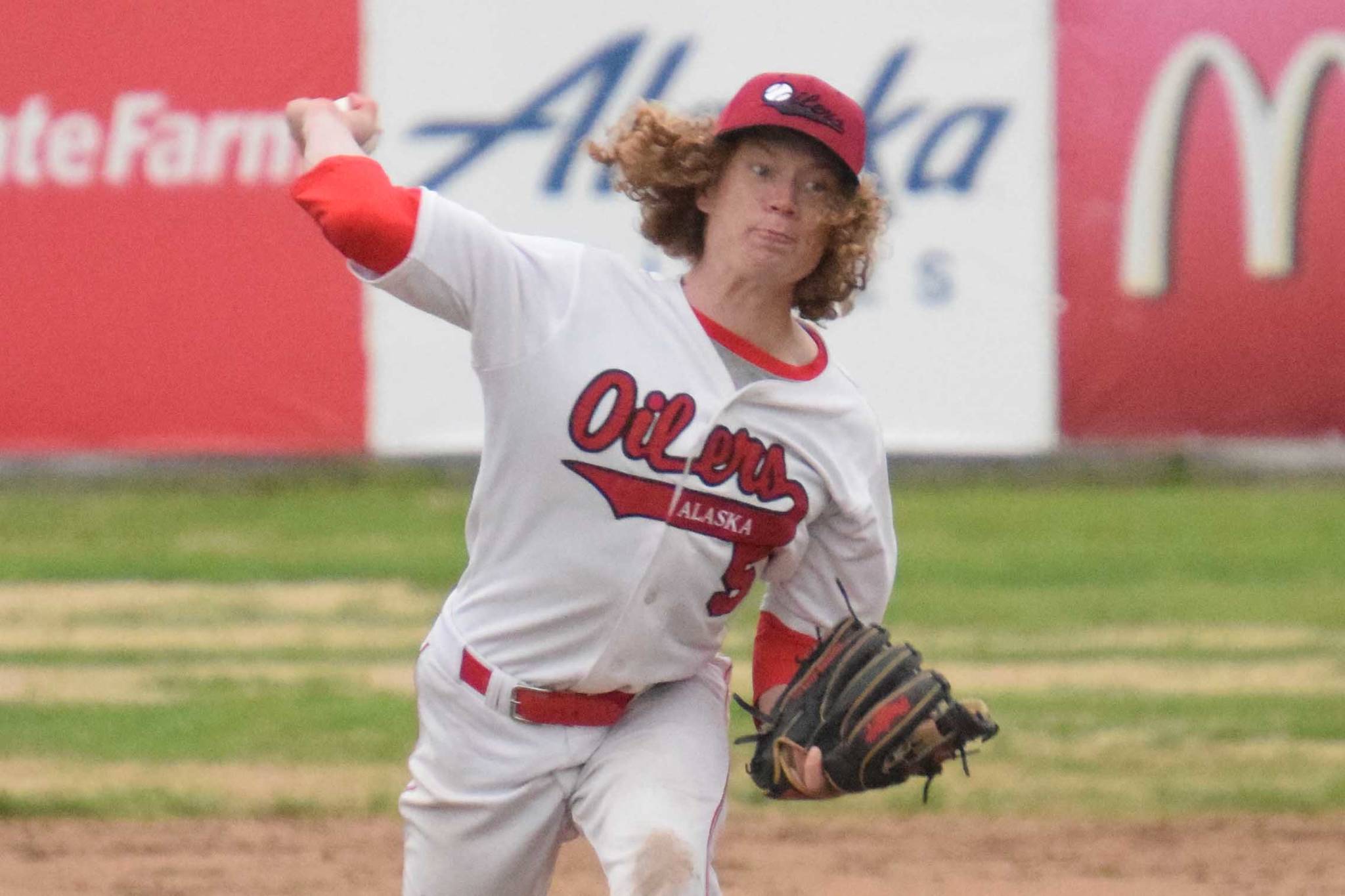 Peninsula Oilers reliever Mose Hayes delivers to the Anchorage Bucs on Friday, June 26, 2021, at Coral Seymour Memorial Park in Kenai, Alaska. (Photo by Jeff Helminiak/Peninsula Clarion)