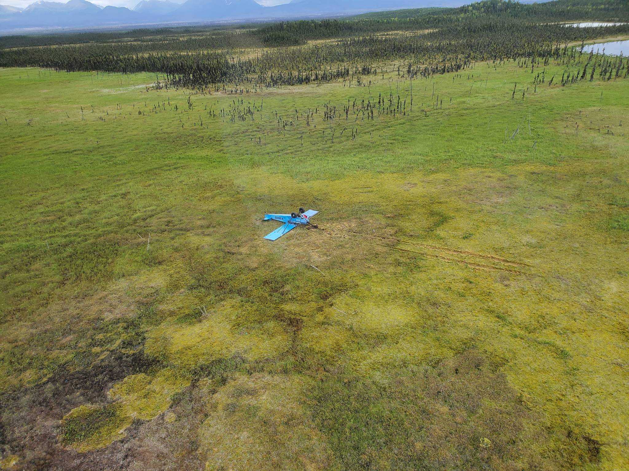 A Piper J3C-65 crash site new Rabbit Foot Lake in the Kenai National Wildlife Refuge on Monday, June 28, 2021, on the Kenai Peninsula, Alaska. (Photo via Alaska State Troopers)