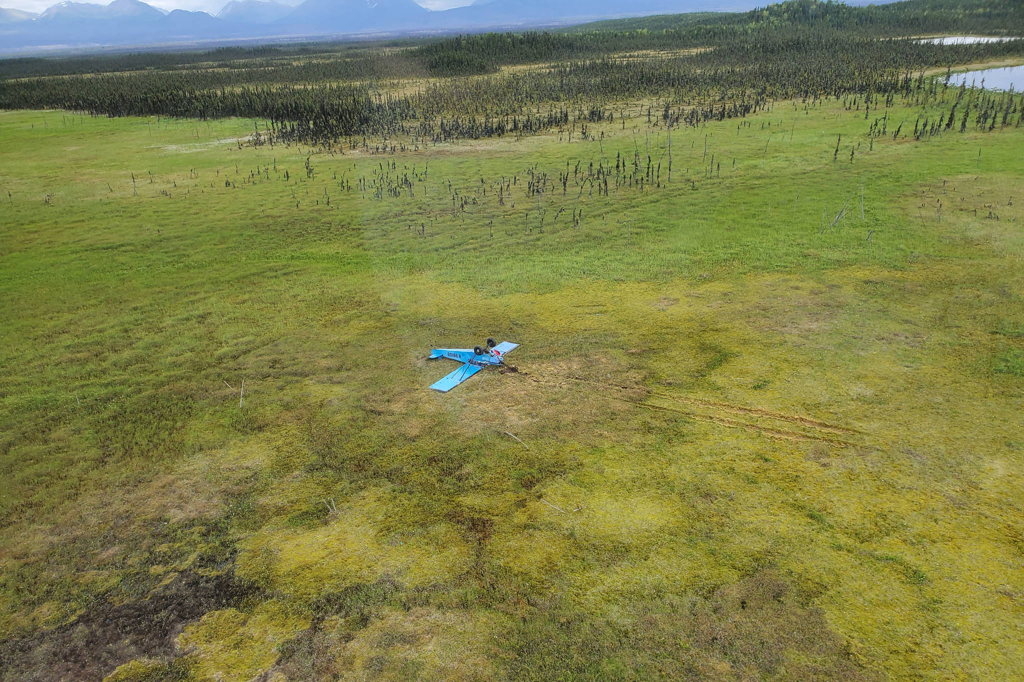 A Piper J3C-65 crash site new Rabbit Foot Lake in the Kenai National Wildlife Refuge on Monday, June 28, 2021, on the Kenai Peninsula, Alaska. (Photo via Alaska State Troopers)