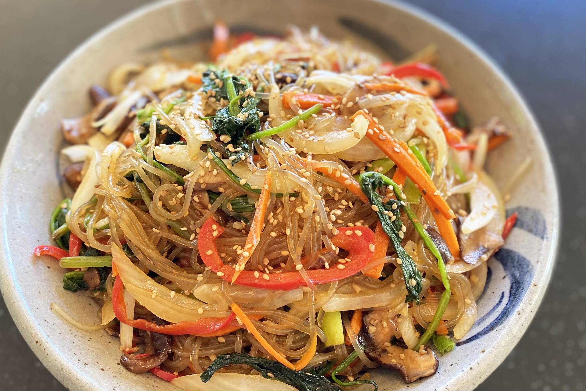 Containing onions, carrots, shitake mushrooms and noodles Japchae is a stir-fried Korean vegetable and noodle dish that is delectable hot, cold and everywhere in between. (Photo by Tressa Dale/Peninsula Clarion)