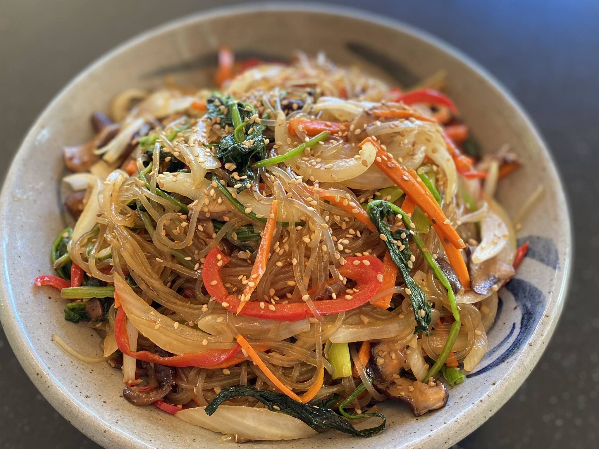 Containing onions, carrots, shitake mushrooms and noodles Japchae is a stir-fried Korean vegetable and noodle dish that is delectable hot, cold and everywhere in between. (Photo by Tressa Dale/Peninsula Clarion)