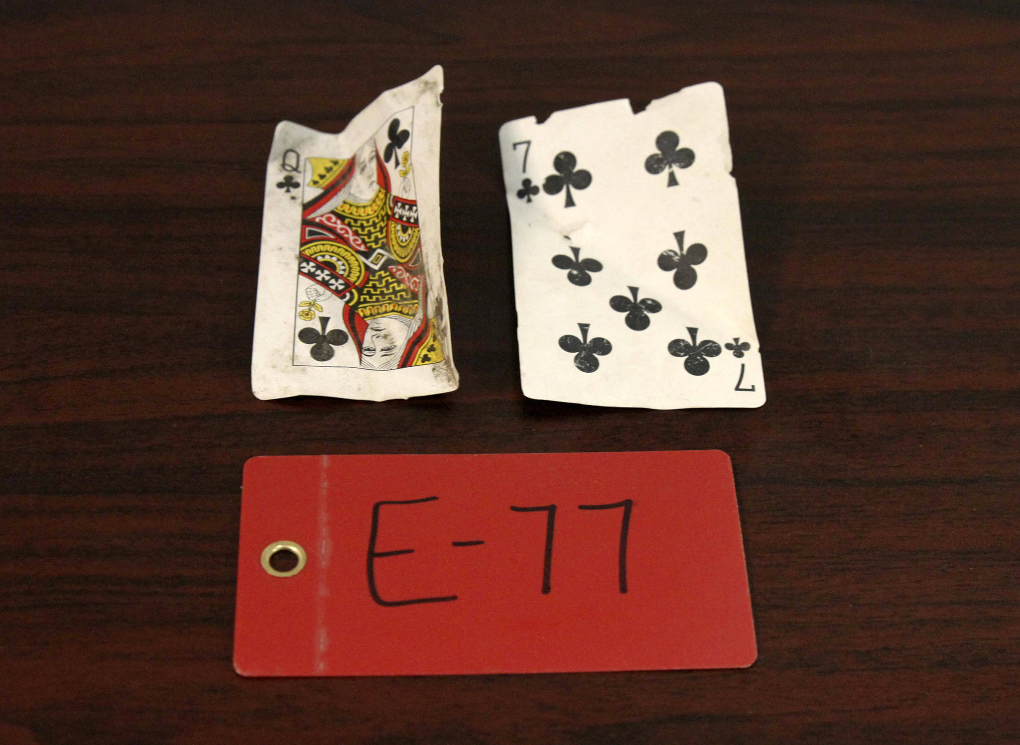 Two playing cards recovered from the 1952 crash of a C-124 Globemaster were found this month on Colony Glacier and displayed at Joint Base Elmendorf-Richardson, Alaska, Tuesday, Sept. 29, 2021. (AP Photo/Mark Thiessen)