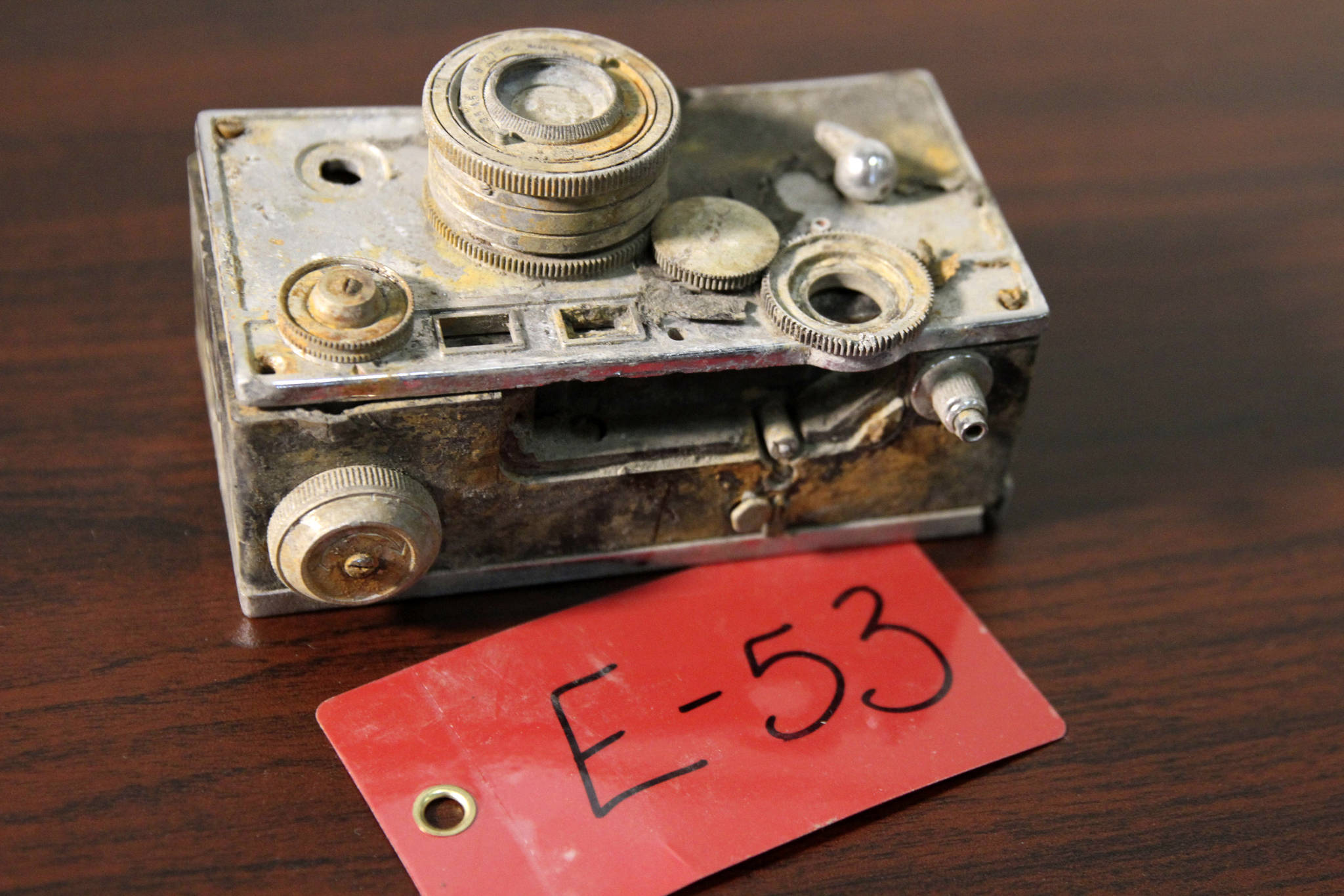 A camera recovered from the 1952 crash of a C-124 Globemaster was found this month on Colony Glacier and displayed at Joint Base Elmendorf-Richardson, Alaska, Tuesday, Sept. 29, 2021. (AP Photo/Mark Thiessen)