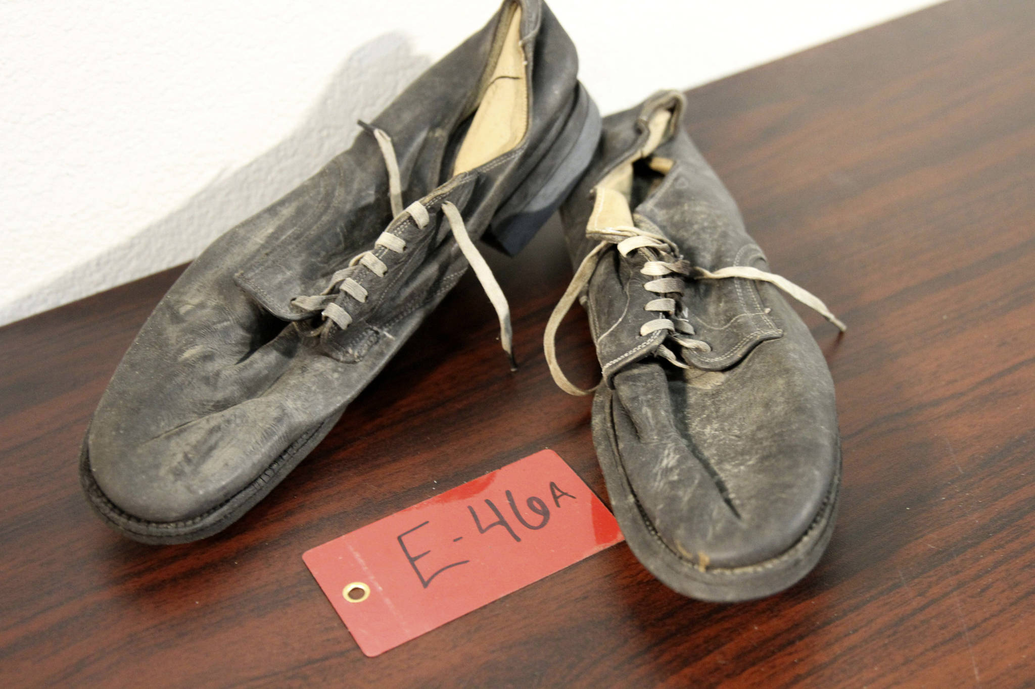 A pair of shoes recovered from the 1952 crash of a C-124 Globemaster were found this month on Colony Glacier and displayed at Joint Base Elmendorf-Richardson, Alaska, Tuesday, Sept. 29, 2021. (AP Photo/Mark Thiessen)