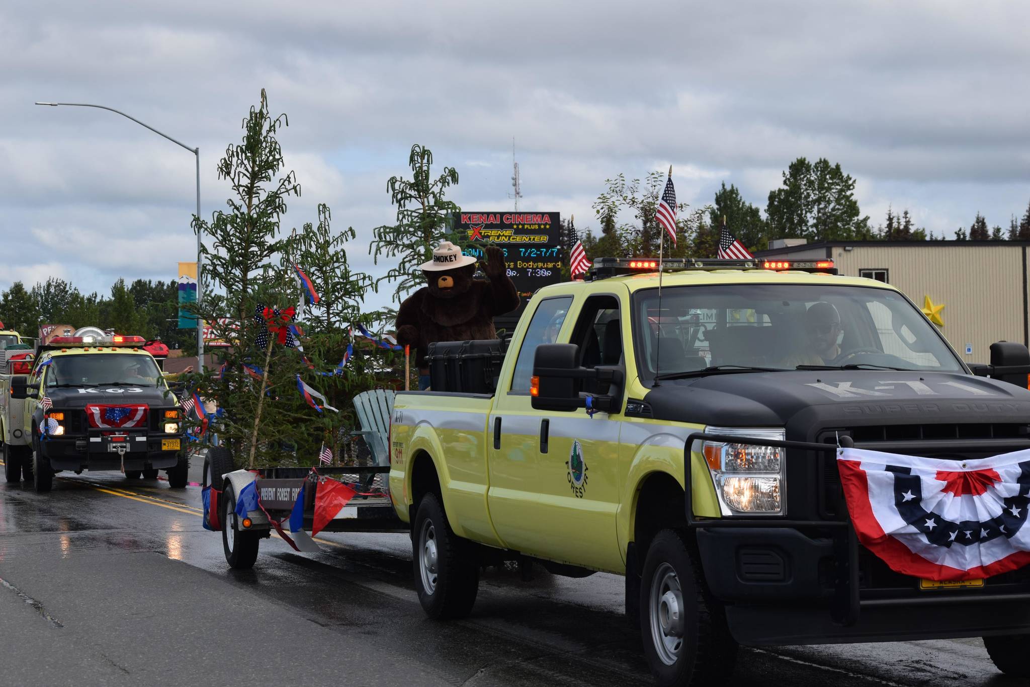Smokey the Bear waves to the crowd during Kenai’s annual Independence Day parade on July 4, 2021. (Camille Botello / Peninsula Clarion)