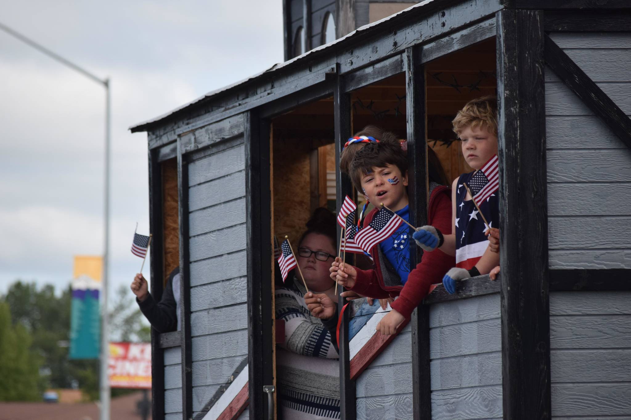 Kids ride in the back of the American Legion float during Kenai’s annual Fourth of July parade on July 4, 2021. (Camille Botello / Peninsula Clarion)