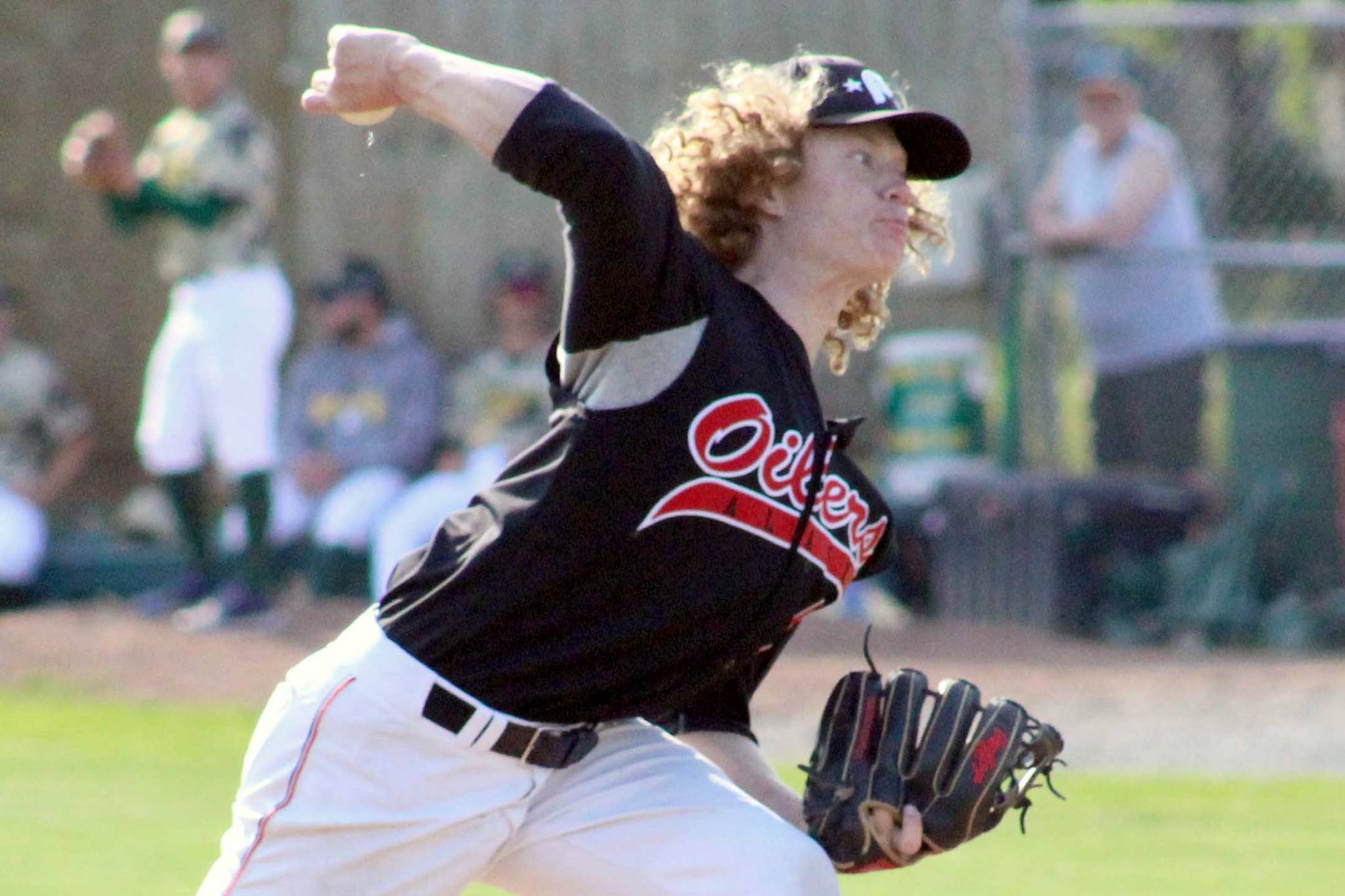 Mose Hayes of the Peninsula Oilers delivers to the Mat-Su Miners on Sunday, July 4, 2021, at Hermon Brothers Field in Palmer, Alaska. (Photo by Tim Rockey/Frontiersman)