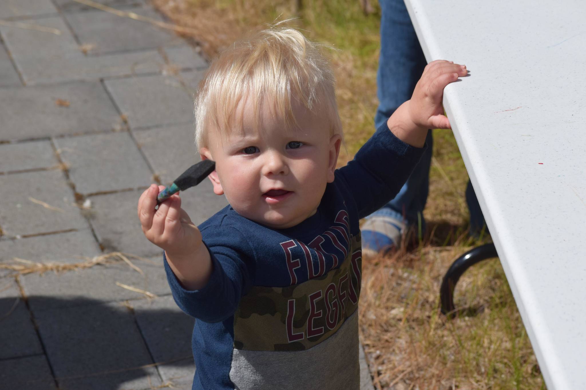 Fynn Bryant participates in the Kenai National Wildlife Refuge’s Fish Week at the visitor center on July 6, 2021. (Camille Botello/Peninsula Clarion)