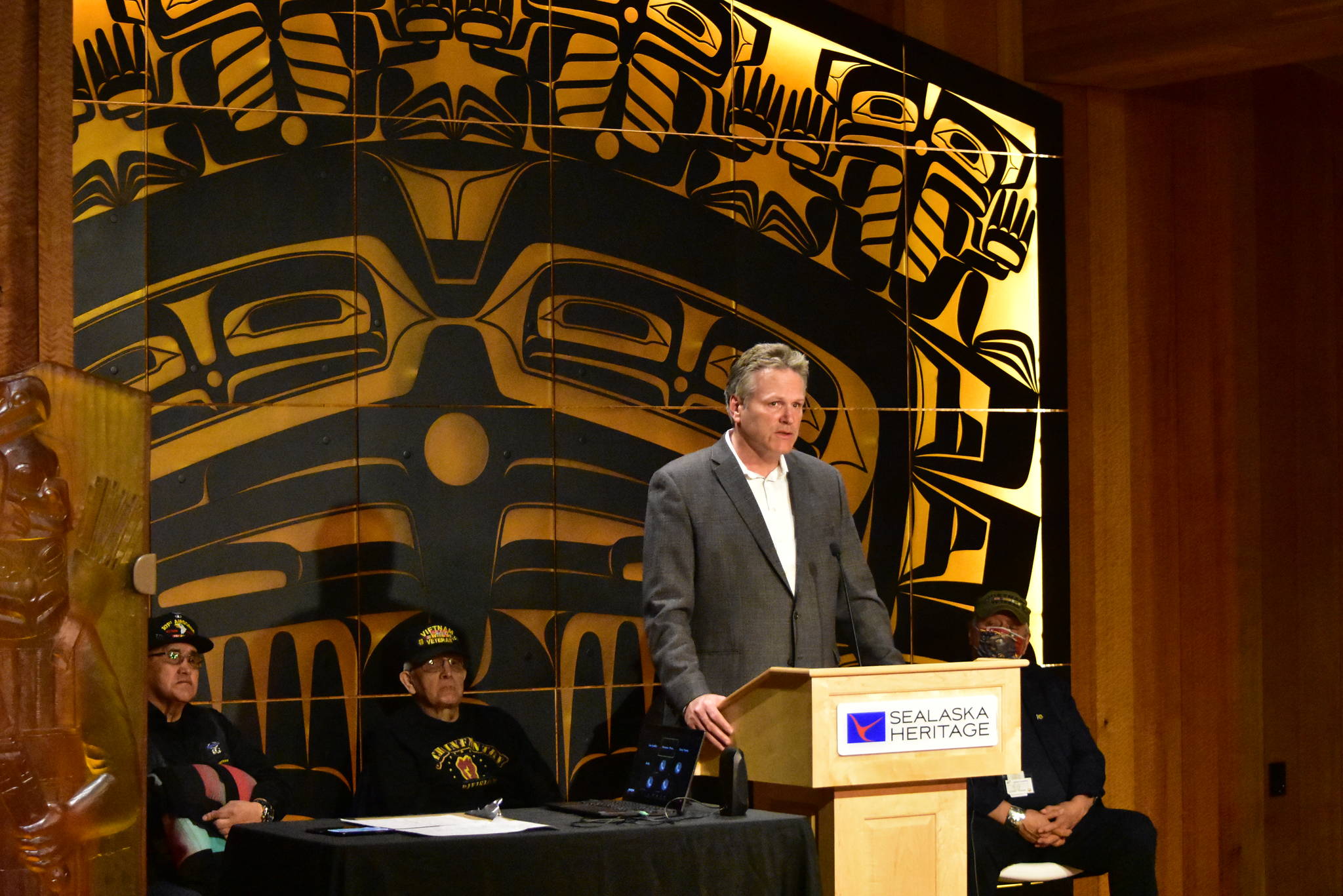 Gov. Mike Dunleavy speaks at a ceremony for Alaska Native Veterans from the Vietnam War era at the Walter Soboleff Building in downtown Juneau on May 5, 2021. Dunleavy announced the state filed a lawsuit Wednesday against the Biden administration for what Dunleavy says is illegally keeping restrictions in place on federal lands in Alaska. (Peter Segall / Juneau Empire)