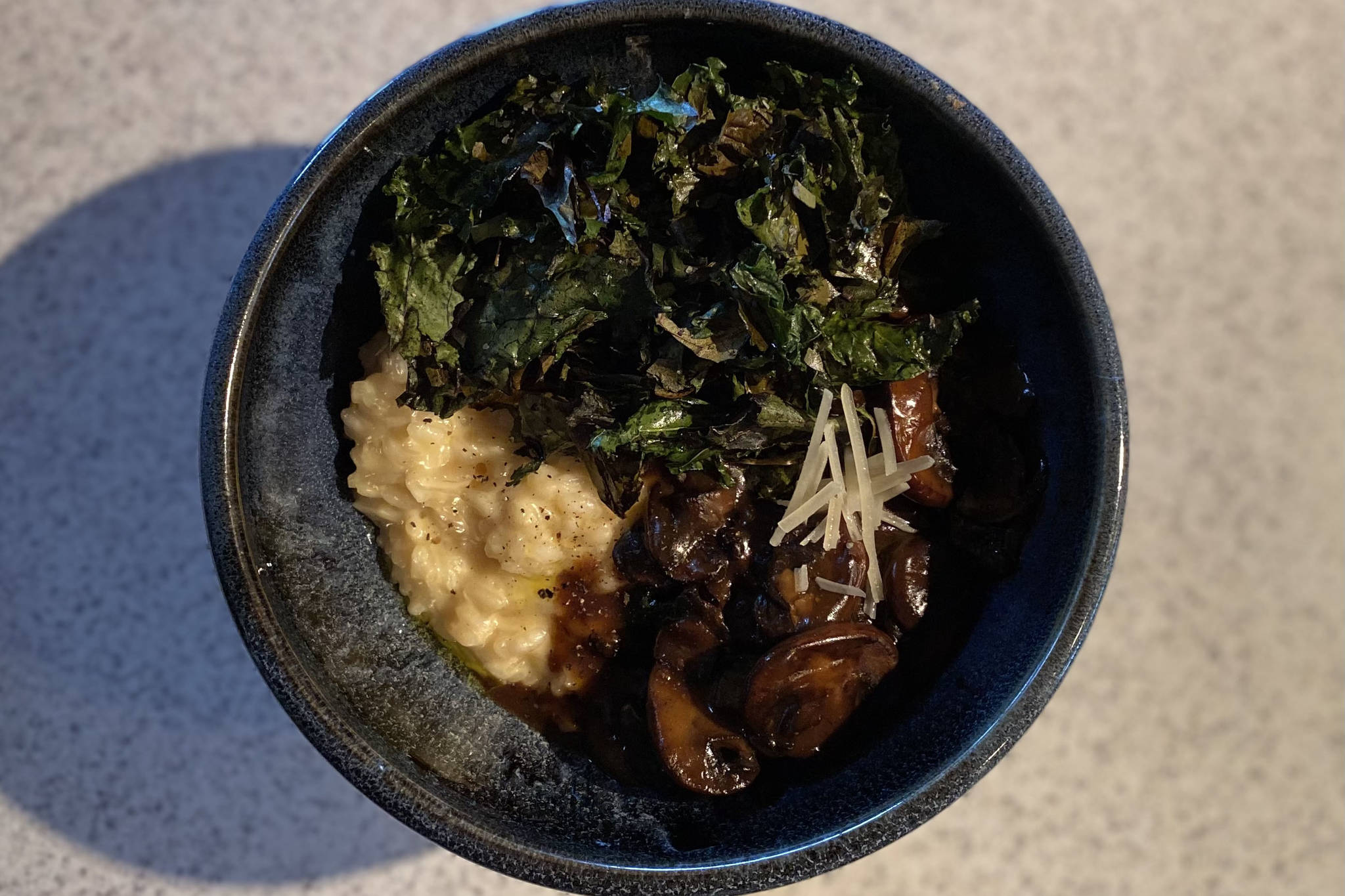 This rich Parmesan risotto makes a creamy base for mushrooms and kale. Photographed July 10, 2021, in Nikiski, Alaska. (Photo by Tressa Dale/Peninsula Clarion)